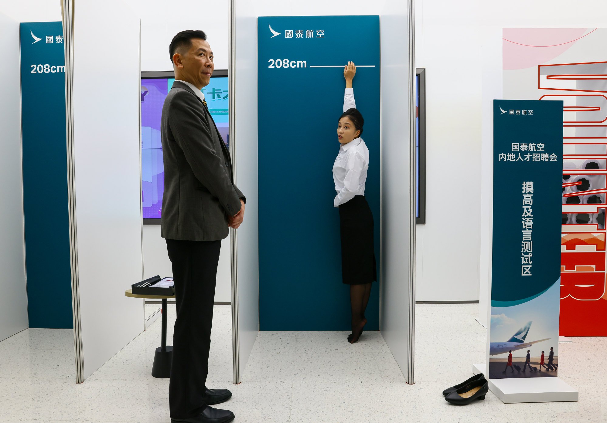 A mainland Chinese woman applies to be a cabin crew member during a recruitment drive in Shenzhen last year. The airline plans to employ 4,000 staff from mainland China by the end of 2025. Photo: Dickson Lee