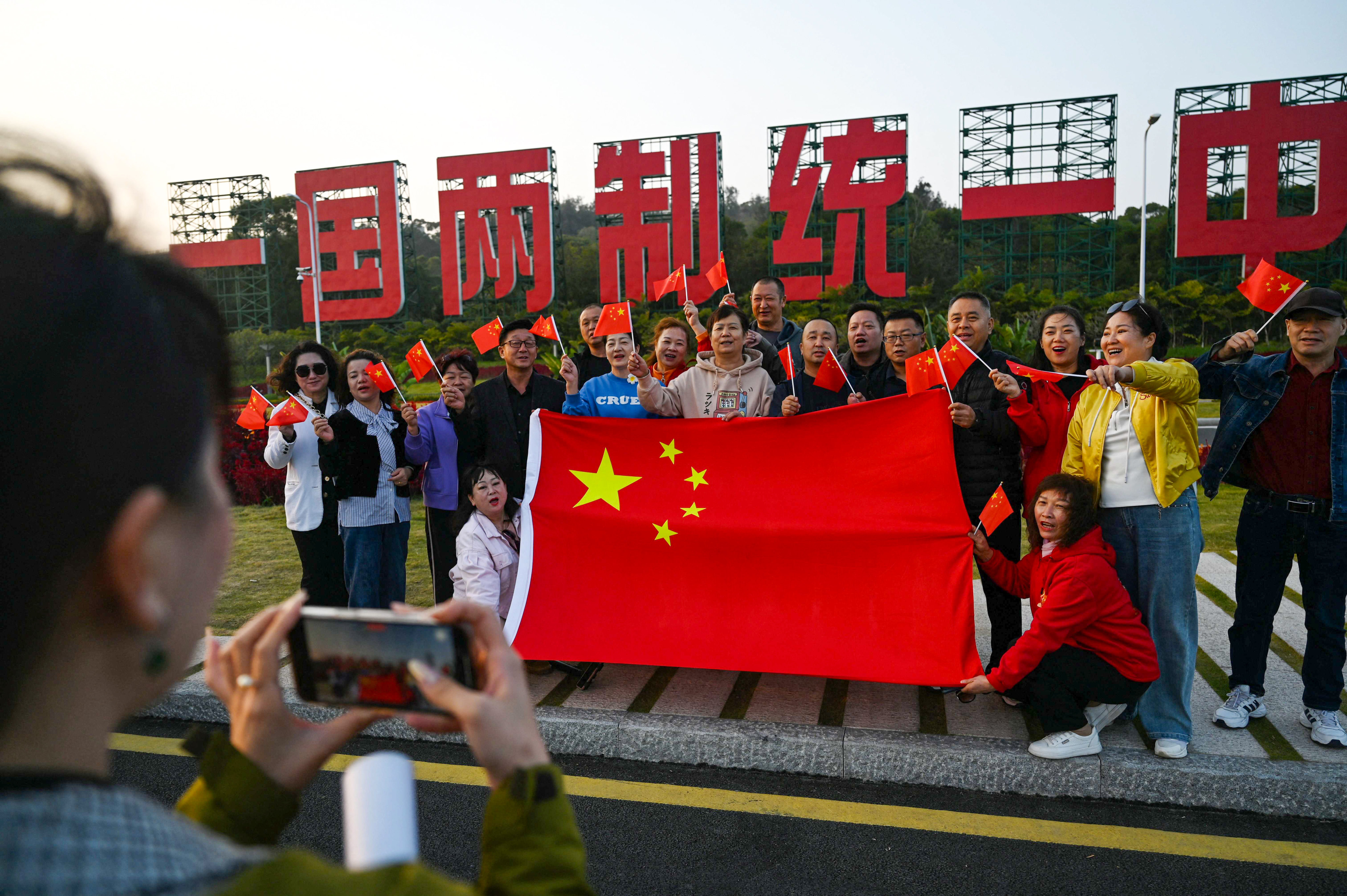 Pro-Beijing voters call for unification with the mainland ahead of the Taiwanese election on Saturday. Photo: AFP