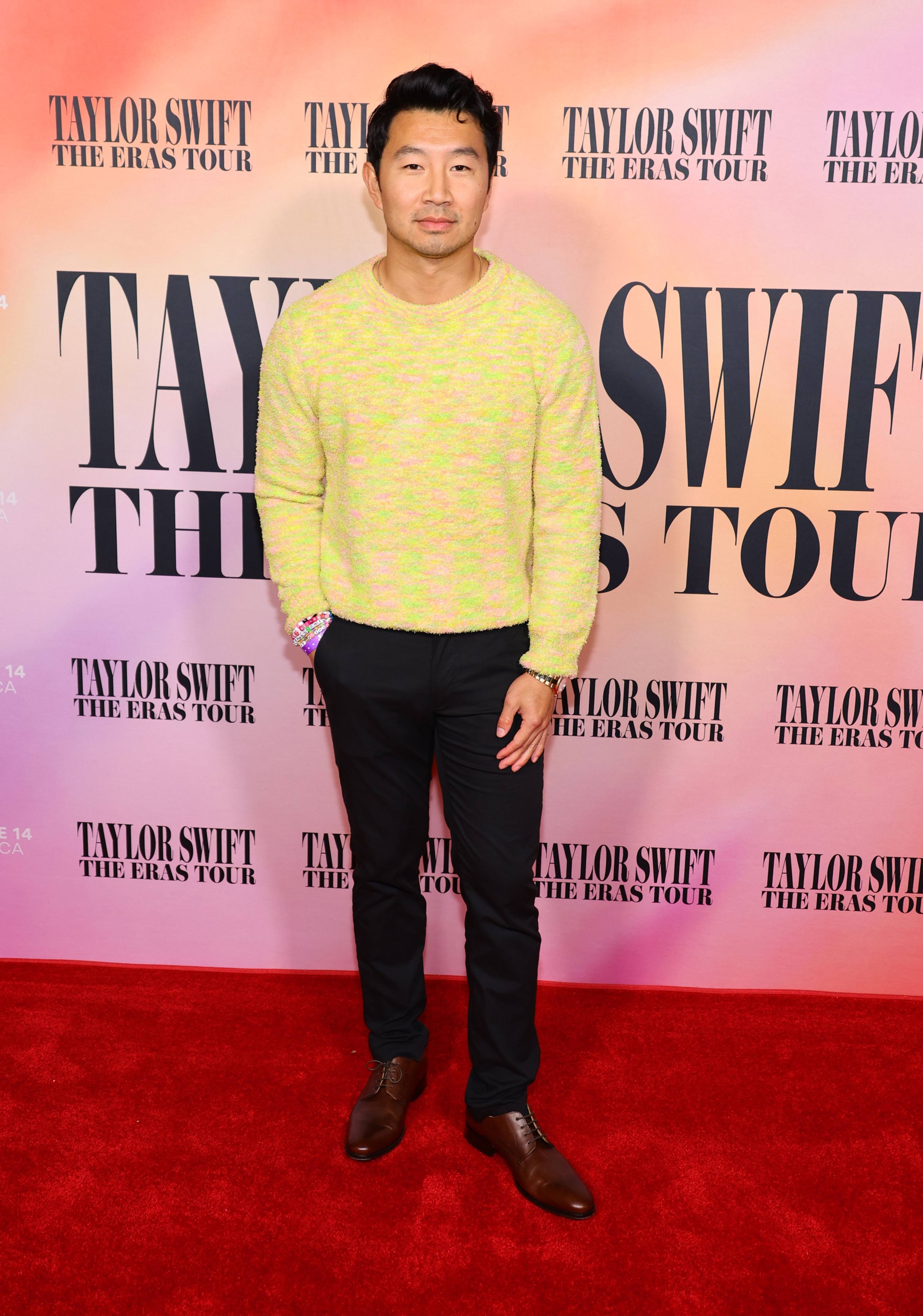 Simu Liu brought a splash of yellow to the red carpet at the premiere of Taylor Swift: The Eras Tour film in October. Photo: Getty Images