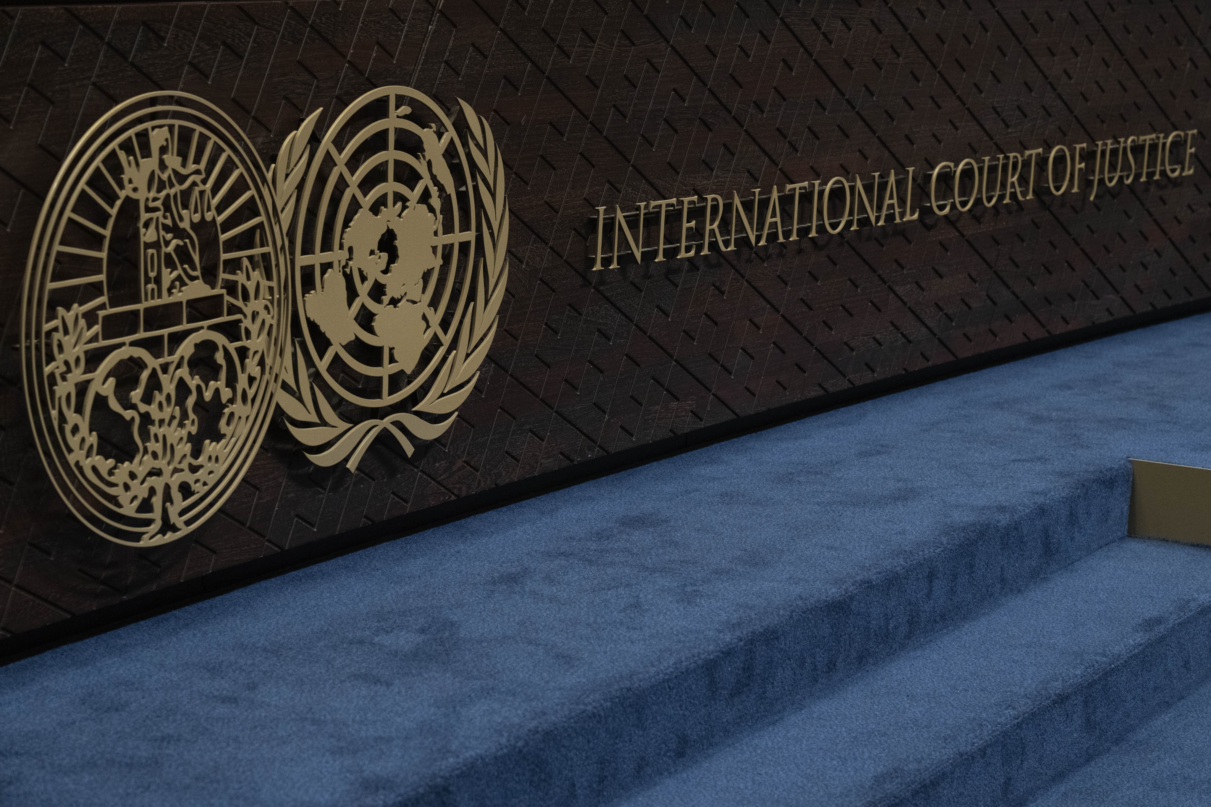 The logos of the International Court of Justice (left) and the United Nations (right) as seen on the ICJ’s headquarters in The Hague, Netherlands. Photo: AP