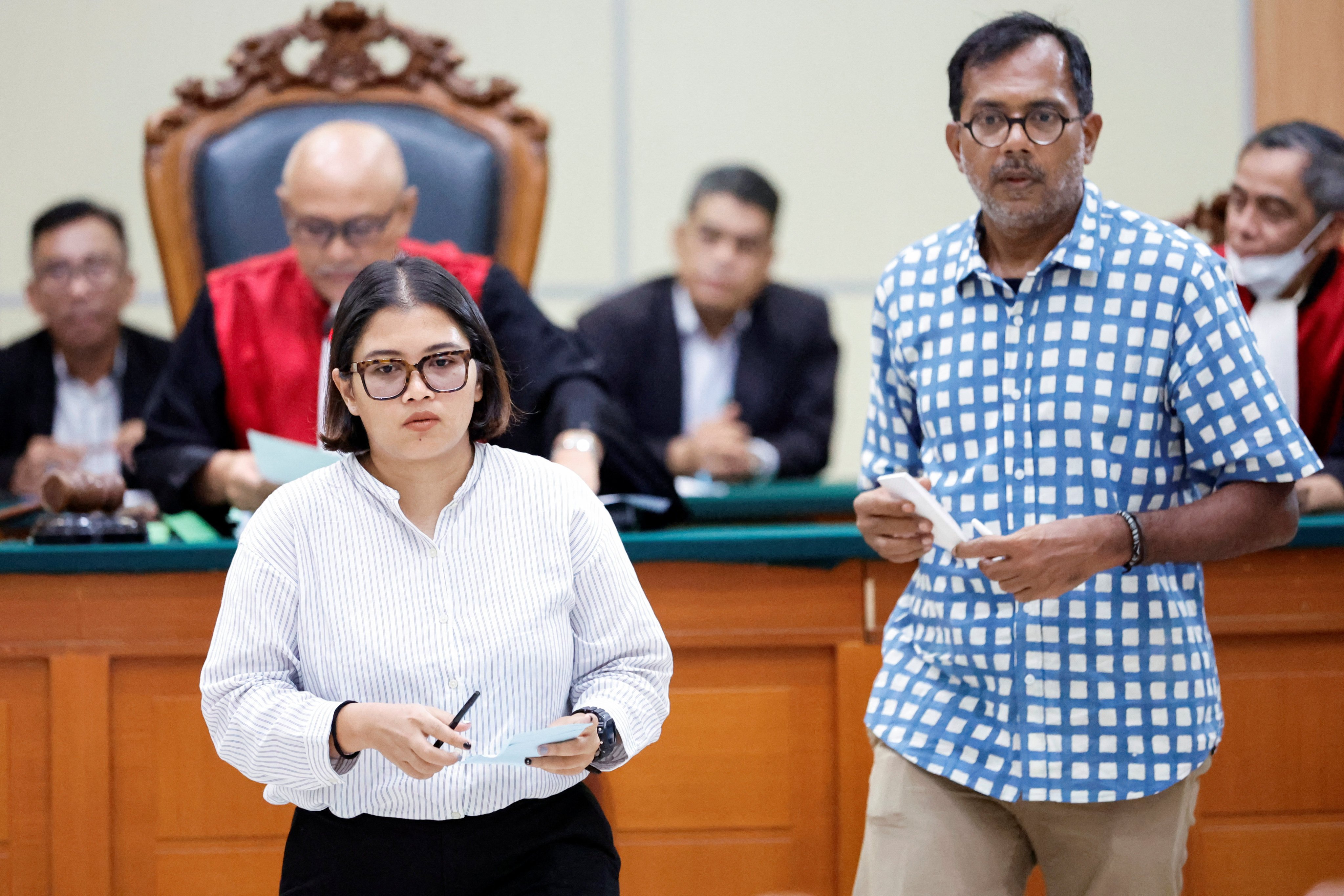 Indonesian activists Fatia Maulidiyanti and Haris Azhar in a court for a case accusing them of defaming Coordinating Minister for Maritime and Investment Affairs Luhut Pandjaitan in Jakarta on January 8. 