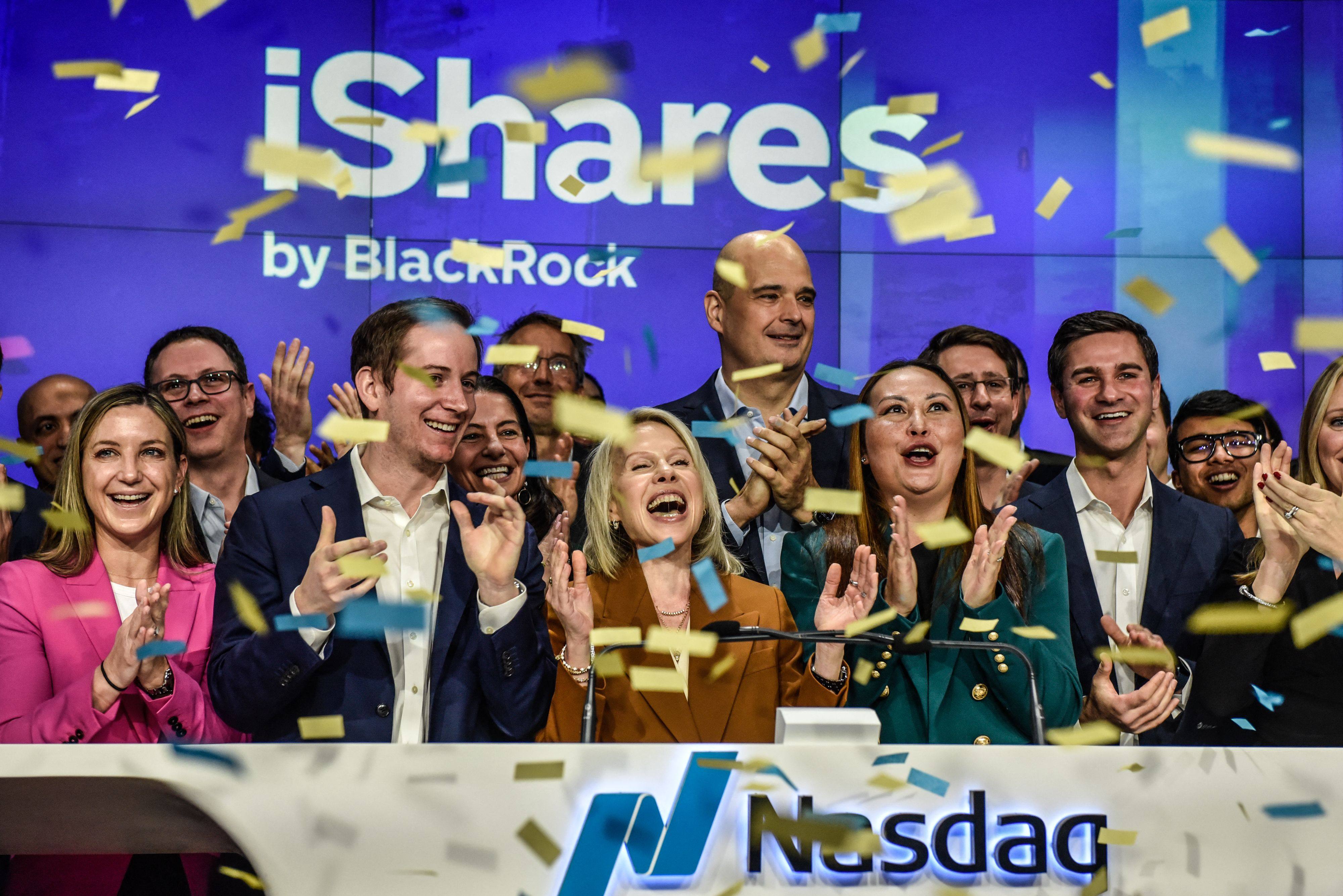Representatives and guests from BlackRock ring the opening bell, as spot bitcoin spot ETFs began trading on the Nasdaq Exchange on Thursday. Photo: Getty Images/AFP 