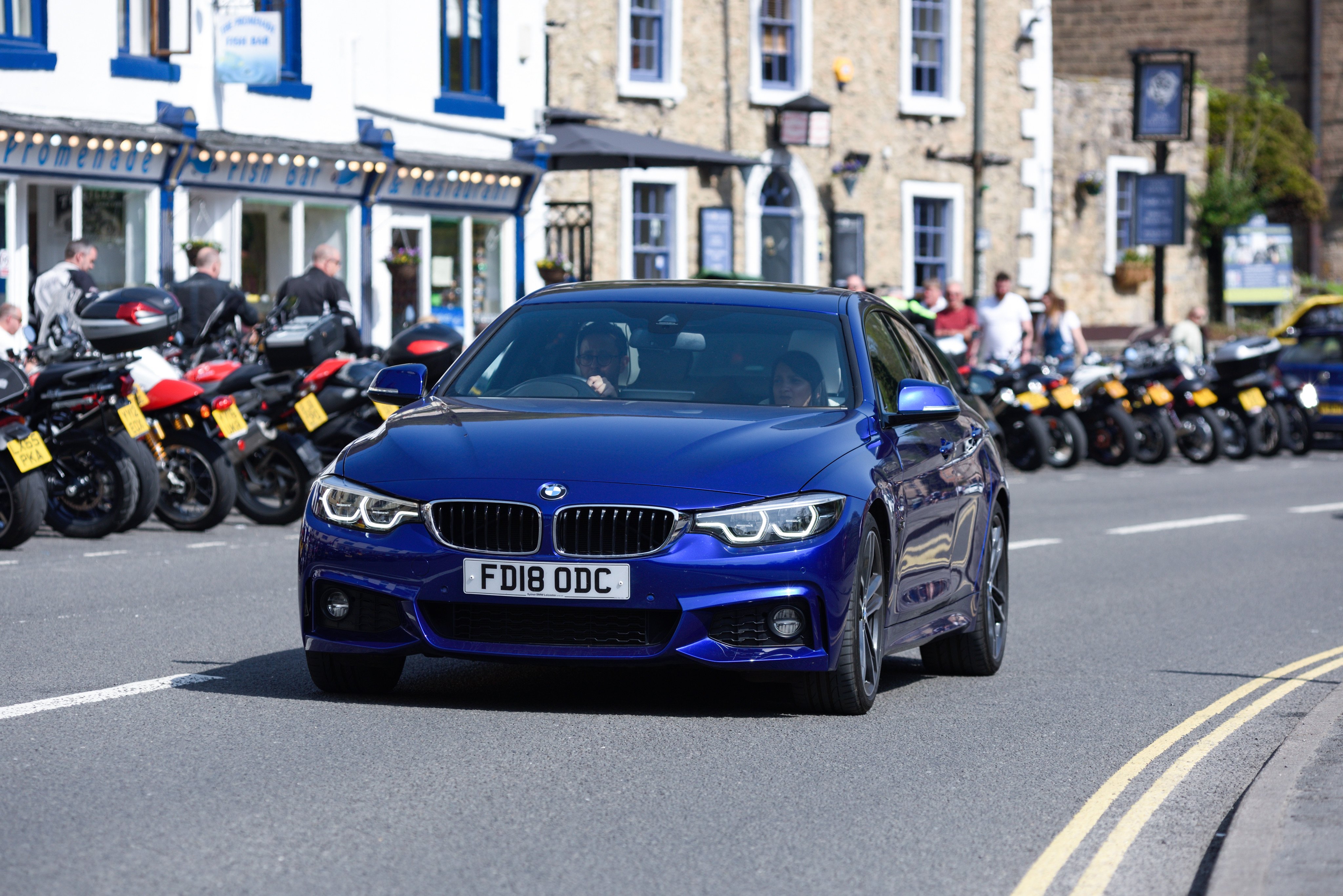 A BMW on a UK road. Drivers of these cars and another German marque, Audi, are the worst violators of speed limits, in the writer’s opinion, and potholes also contribute to make driving in Britain a misery at times. Photo: Shutterstock