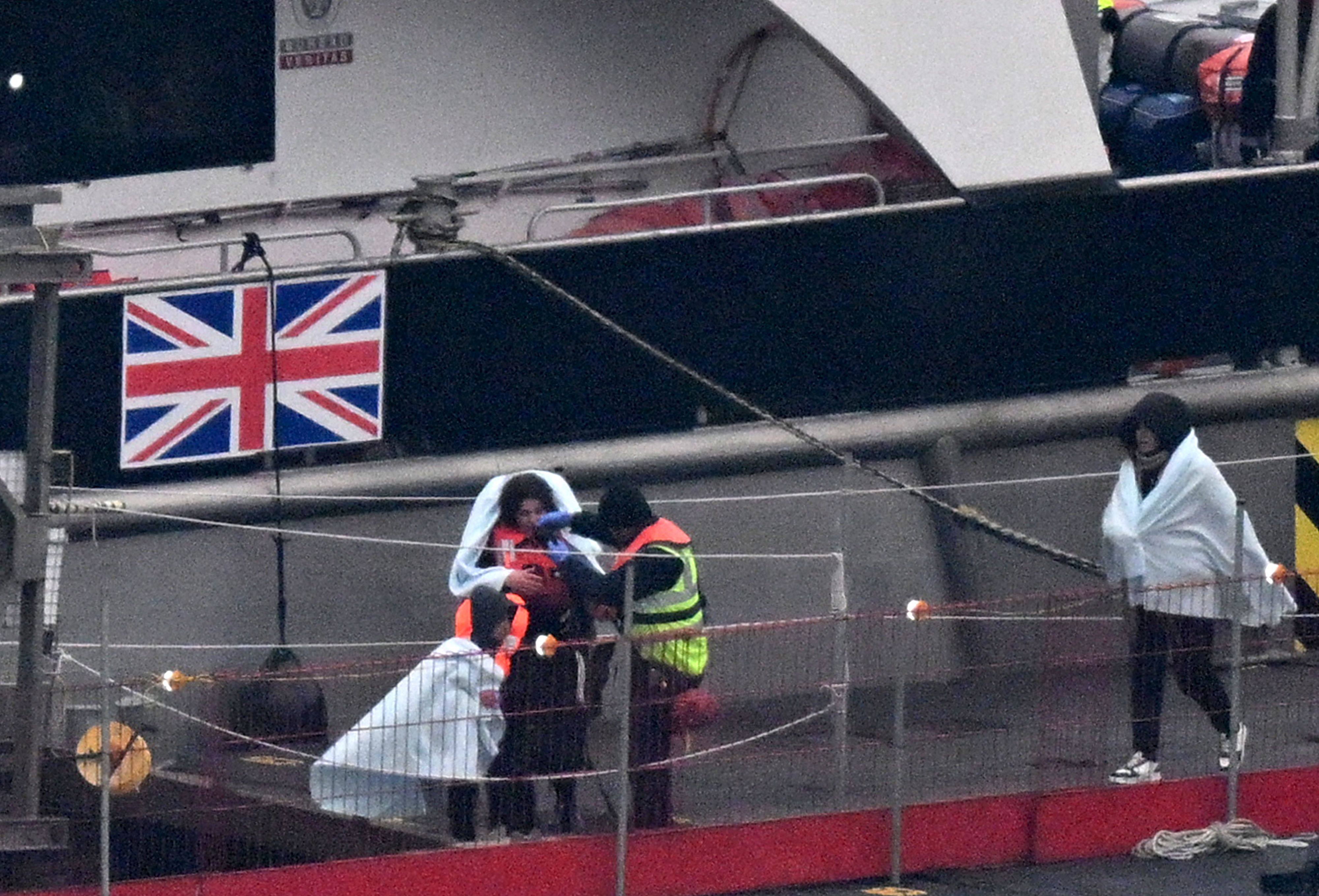 Migrants with children picked up at sea while attempting to cross the English Channel from France on January 13. Photo: AFP