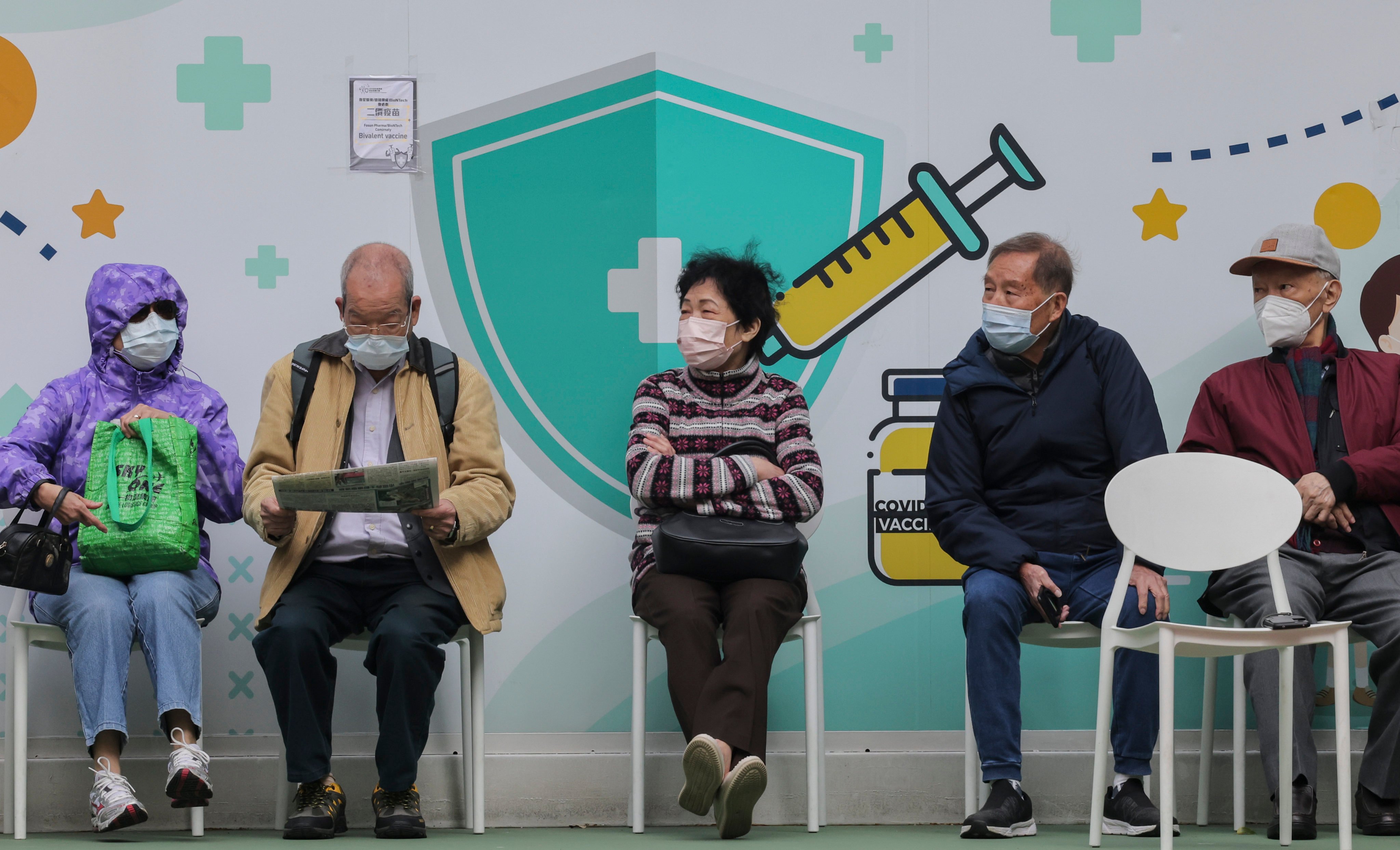 People wait to get a Covid-19 jab at the Java Road Playground Community Vaccination Station in Hong Kong on January 4 last year. Hongkongers are worried about a recent rise in both flu and Covid-19 cases. Photo: Jelly Tse