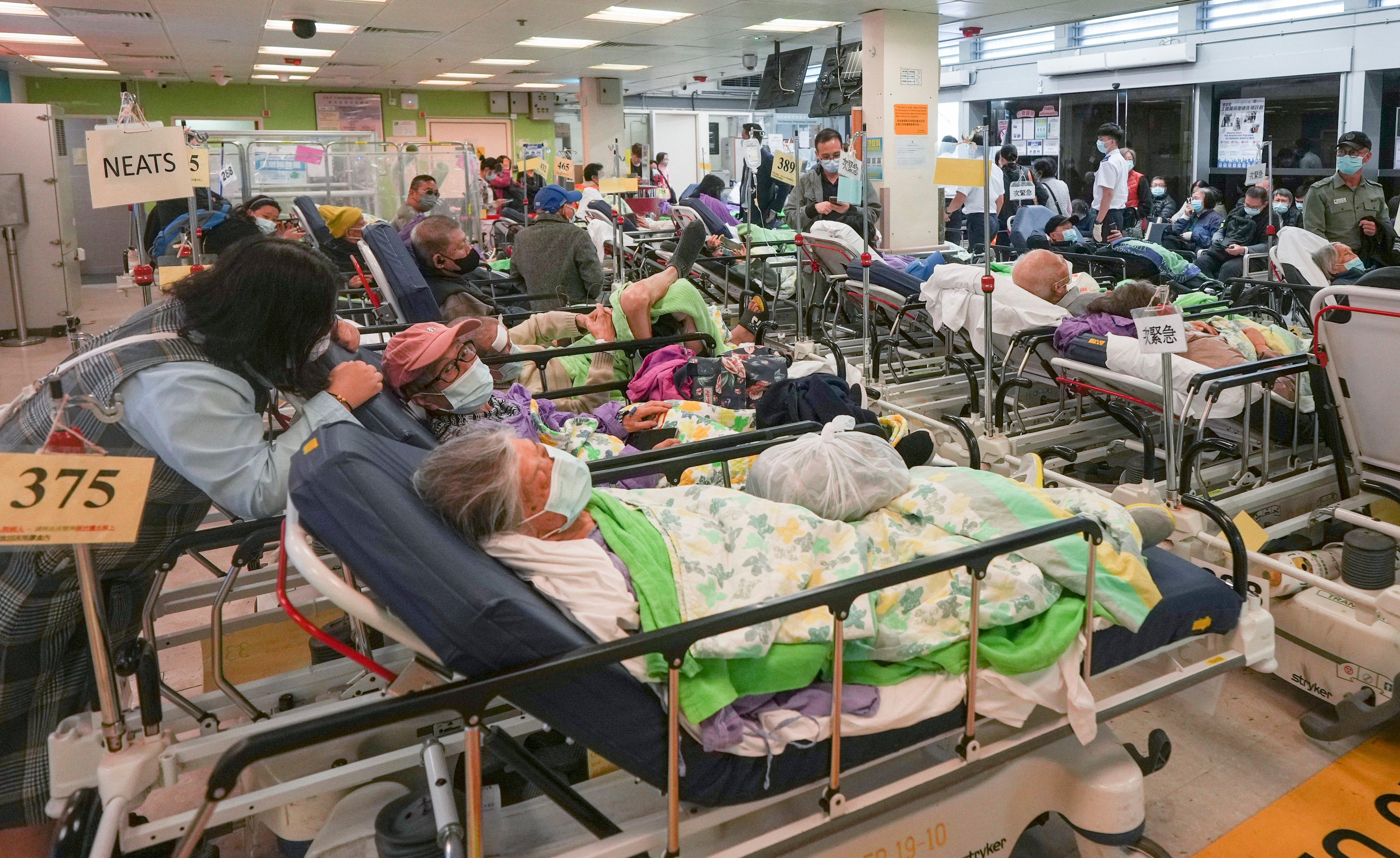Patients wait for treatment at the A&E department of Queen Elizabeth Hospital in Hong Kong’s Jordan district on January 9. A rise in flu cases in the city has increased pressure on public hospitals, leading city leaders to explore increasing costs for people who go to A&E departments for non-emergency treatment. Photo: Eugene Lee