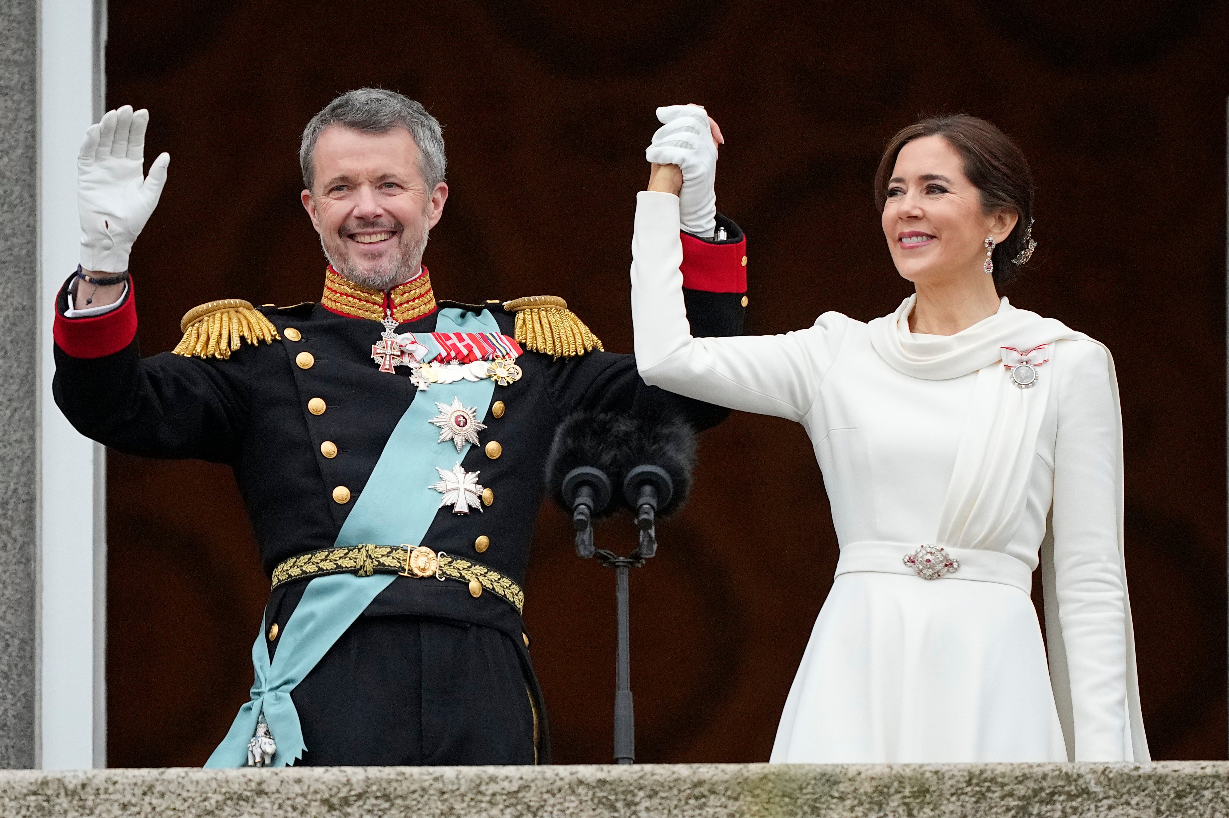 Denmark’s King Frederik X and Denmark’s Queen Mary wave from the balcony of Christiansborg Palace in Copenhagen on January 14. Photo: AP