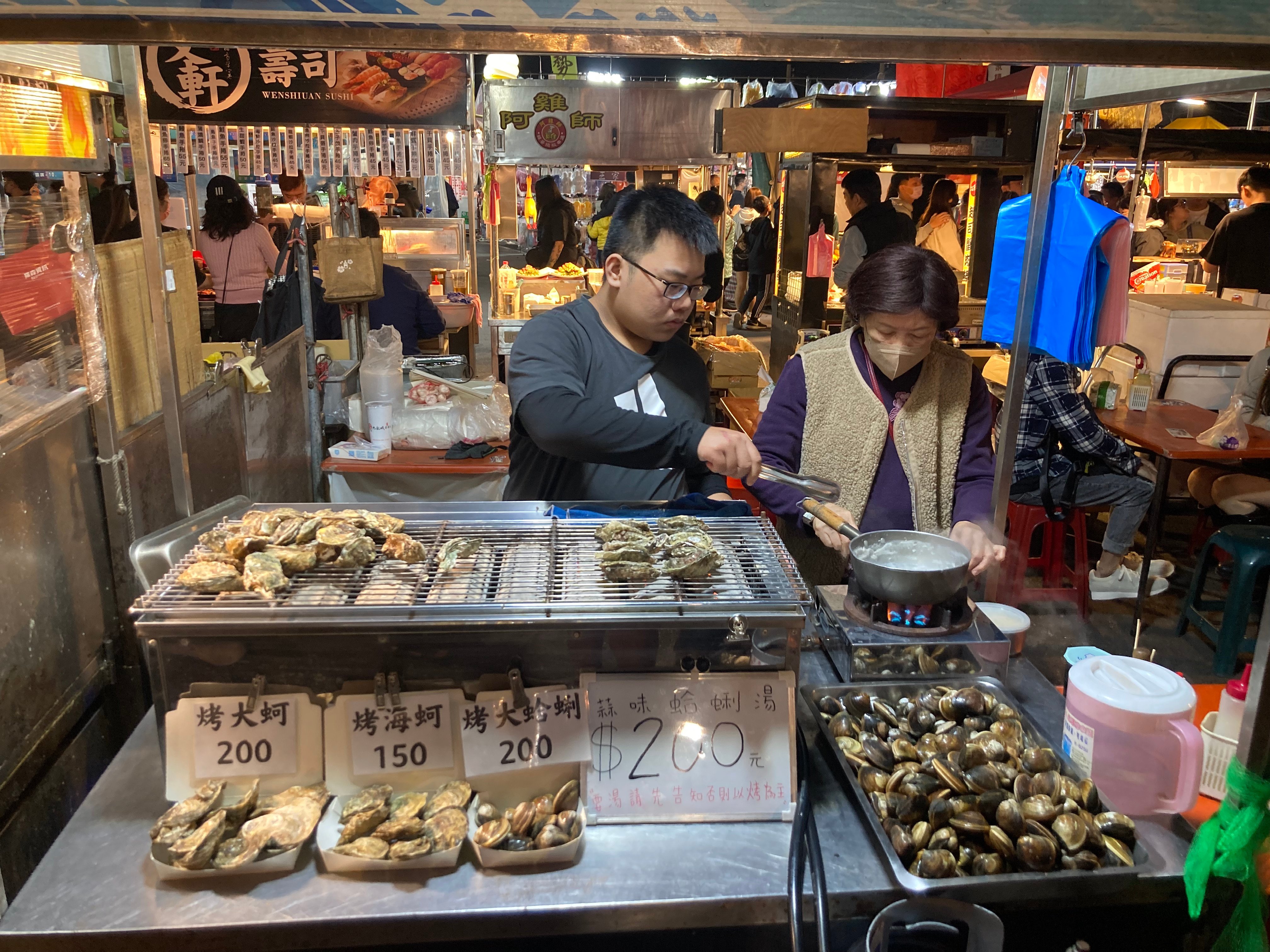 A grilled oyster stall at Tainan’s Flower Night Market. The night markets of Taiwan’s oldest city offer the largest selections of food, while other local delicacies can be found at places like hotpot restaurants. Photo: Cameron Dueck