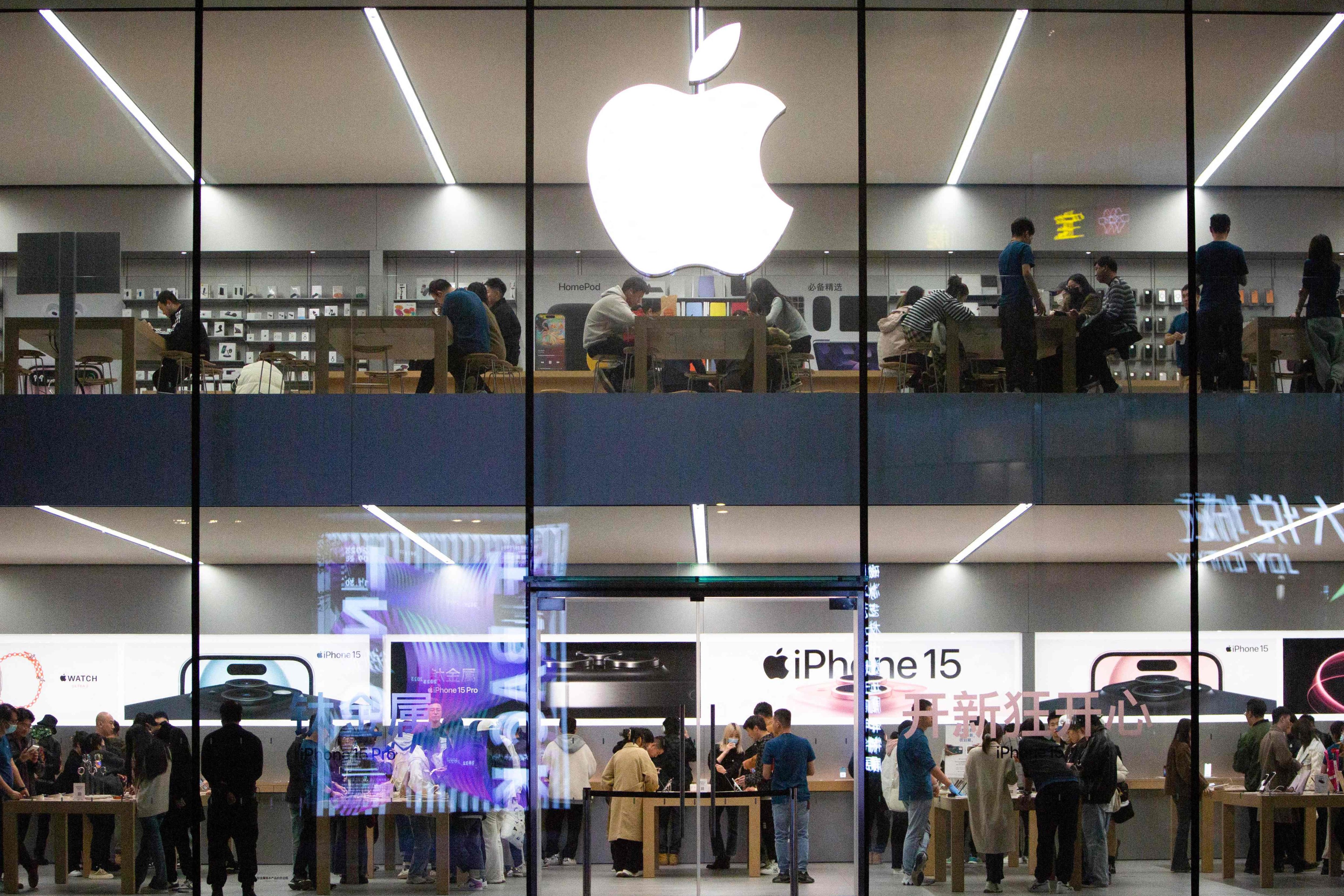 This photo taken on October 30, 2023 shows people visiting an Apple store in Shenyang, in China’s northeastern Liaoning province. Photo: AFP
