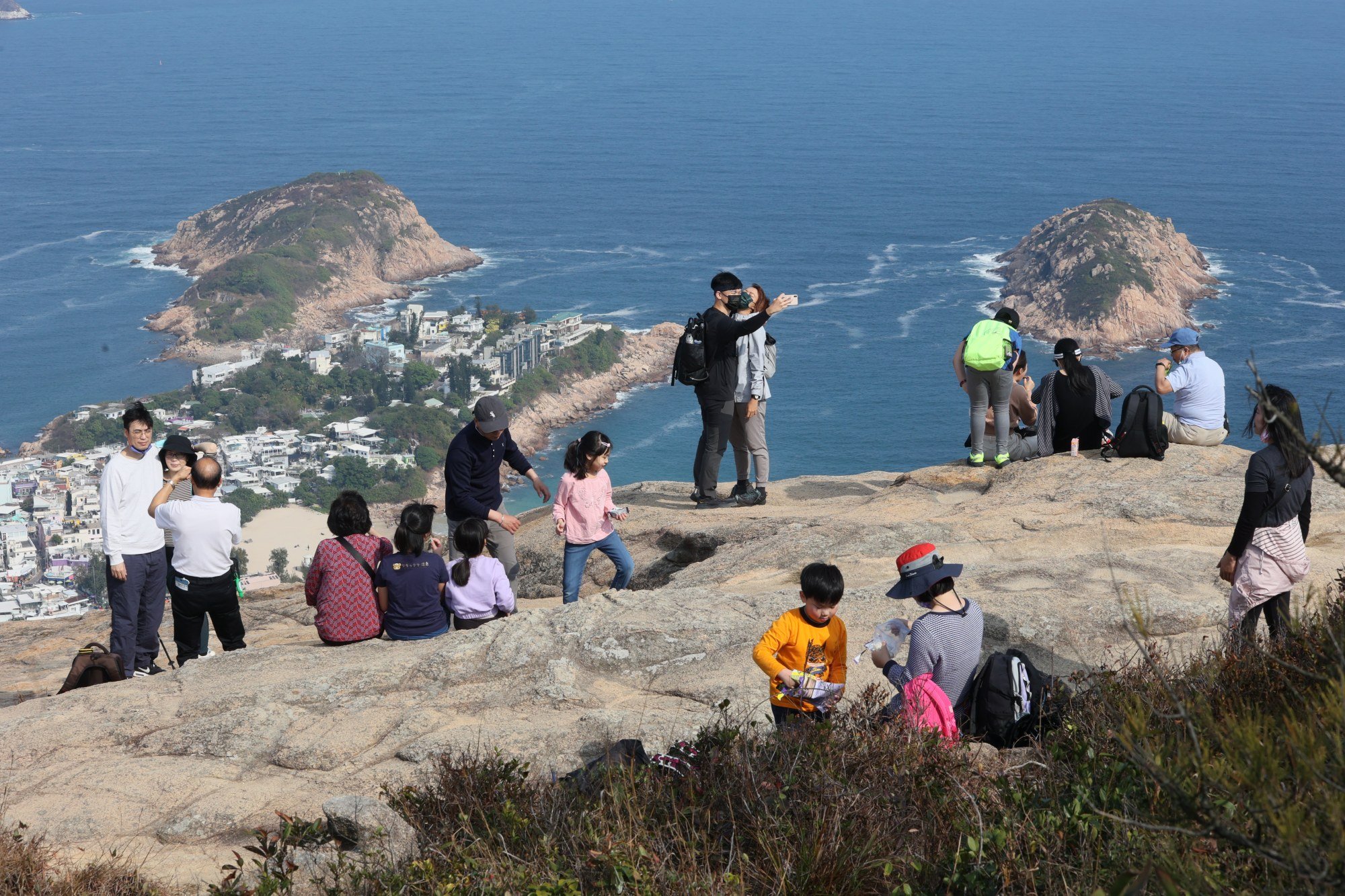 Hikers enjoy the sunny weather on the Dragon’s Back trail in Shek O. Photo: Dickson Lee