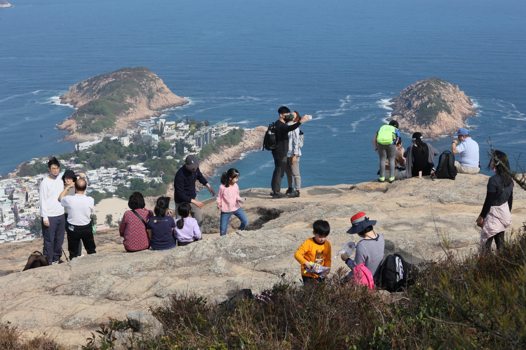 Hikers enjoy the sunny weather on the Dragon’s Back trail in Shek O. Photo: Dickson Lee