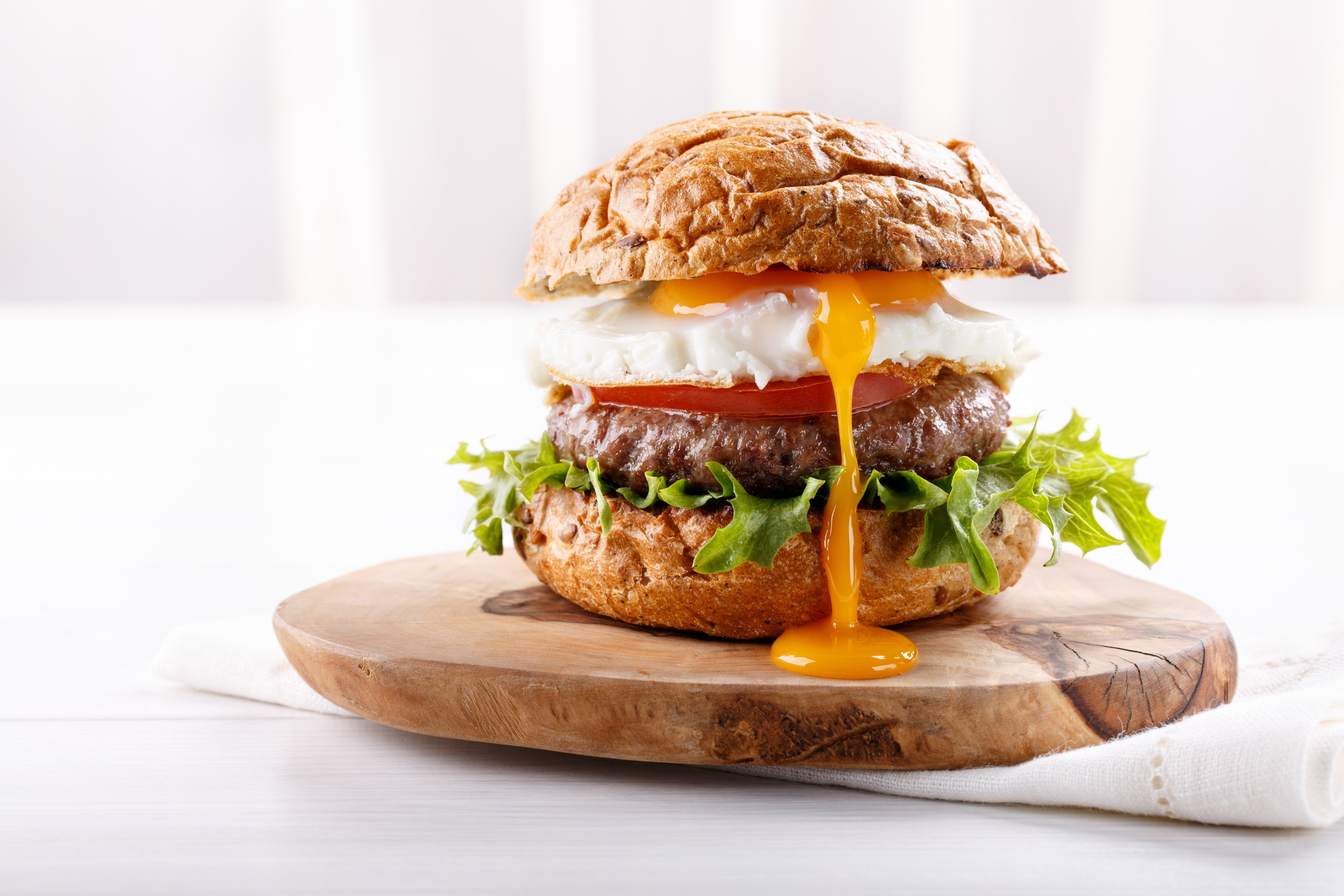 A sunny-side-up egg, double patties, “smash”, peanut butter – burgers can get needlessly complicated. Andrew Sun mouths off about why it is so hard to get a plain, simple hamburger these days. Photo: Shutterstock