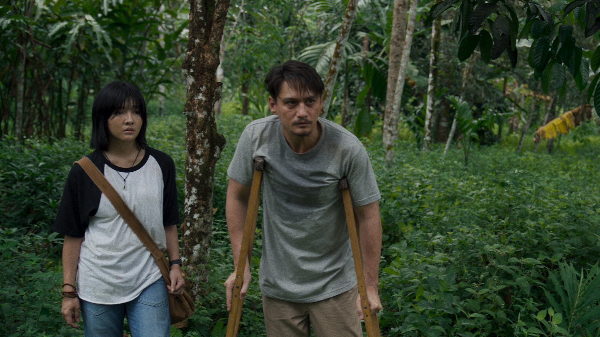 Jennis Oprasert (left) as May and Ananda Everingham as Mit in a still from “The Cursed Land”. Photo: courtesy of Panu Aree/Neramitnung Film.