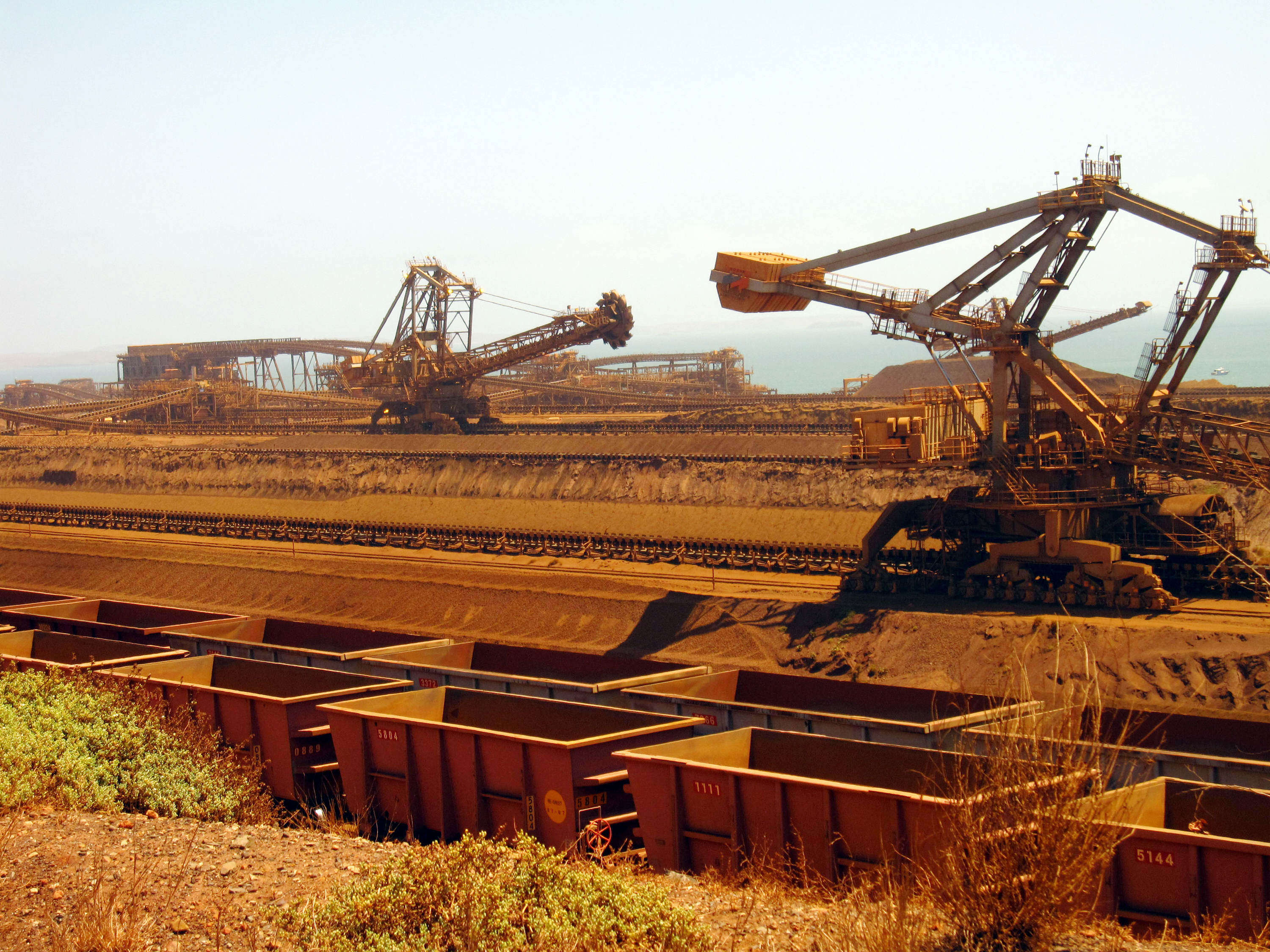 Machines mov iron ore to rail cars at Rio Tinto’s operations in Western Australia. The company expects global iron ore demand will rise almost a quarter by 2050, thanks in large part to China. Photo: AFP