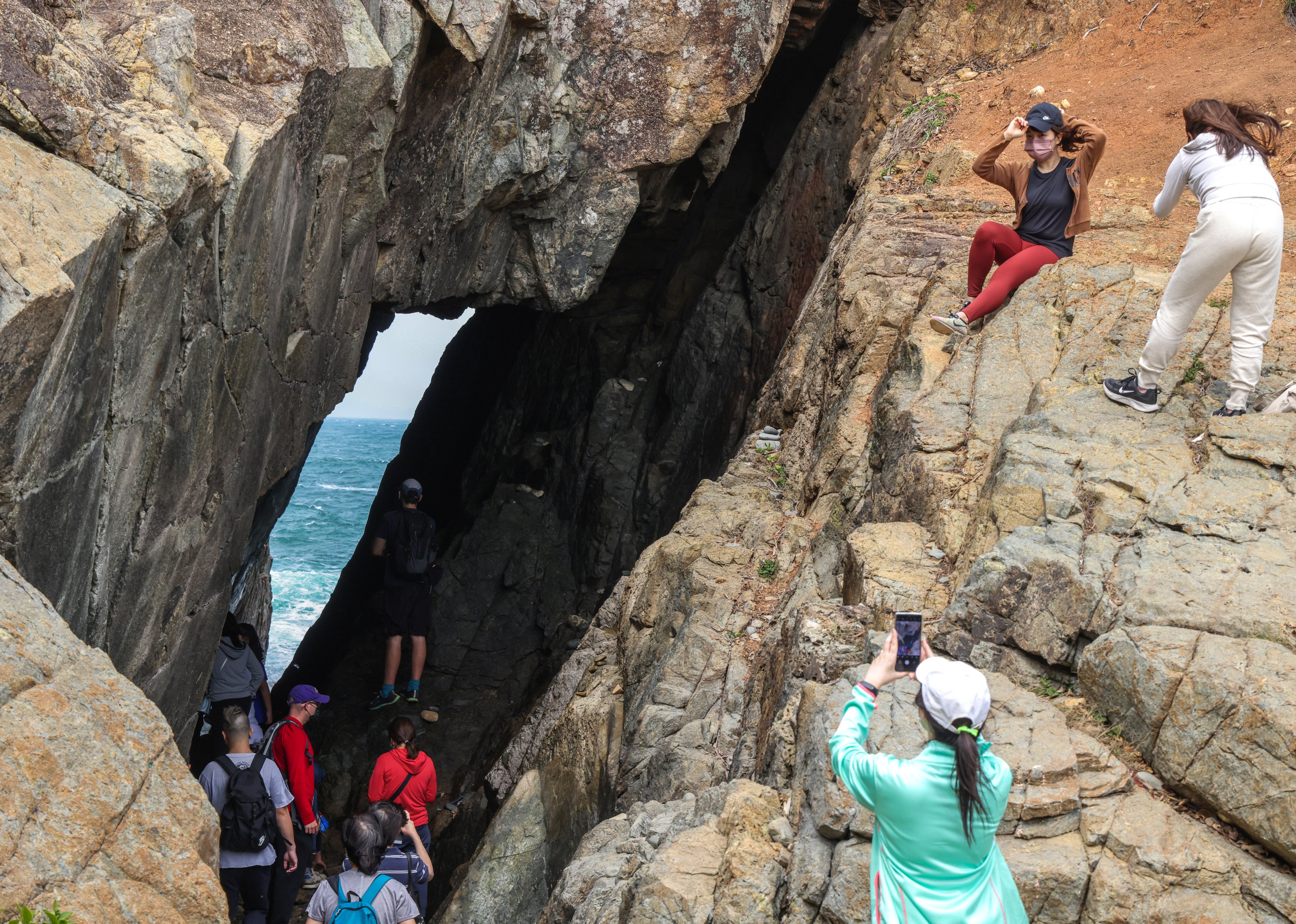 Hiking experts warn that switching your focus to your camera on rough terrain leaves you a single step from a fall. Photo: Jelly Tse