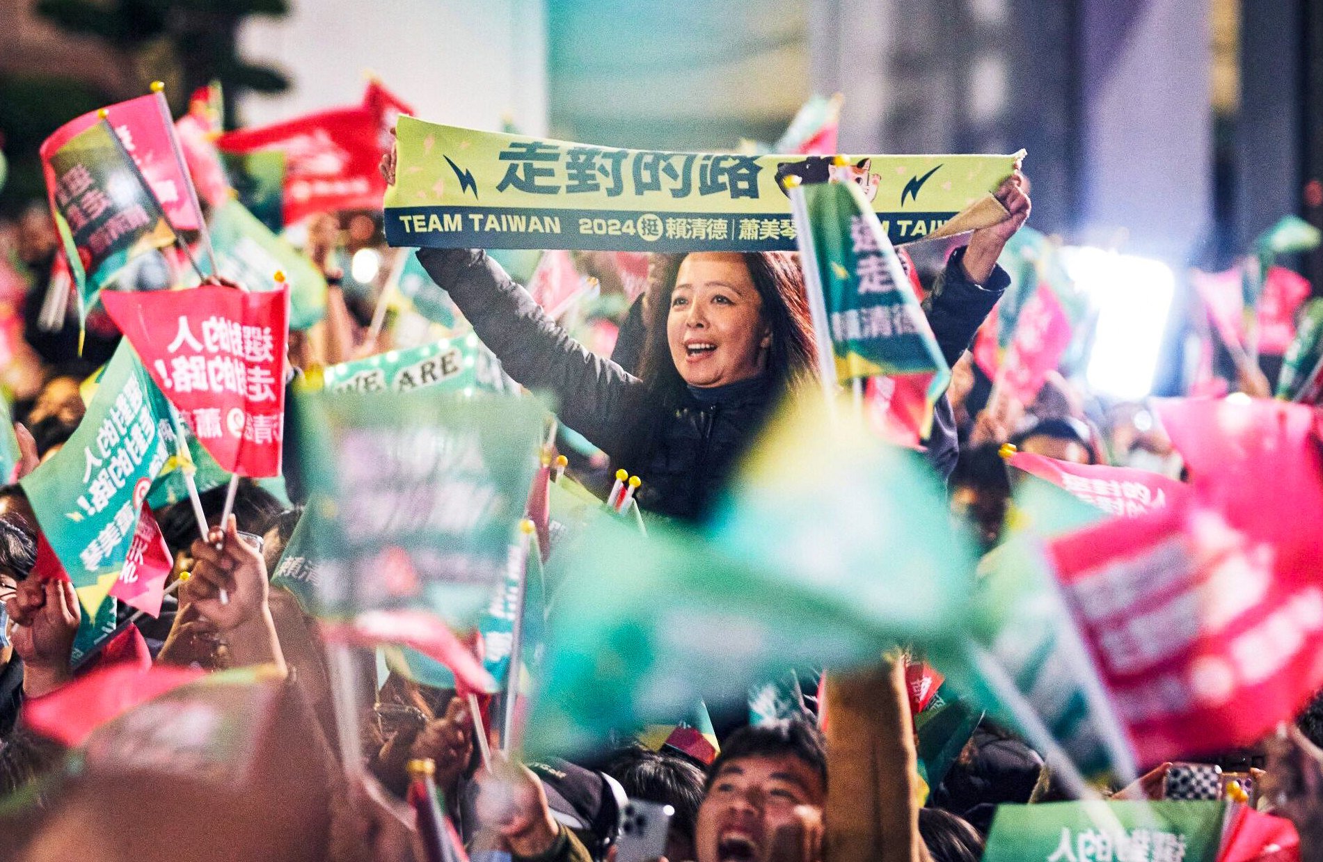 Supporters of Taiwan’s Democratic Progressive Party rally during the island’s presidential election in Taipei on Saturday. Photo: Bloomberg