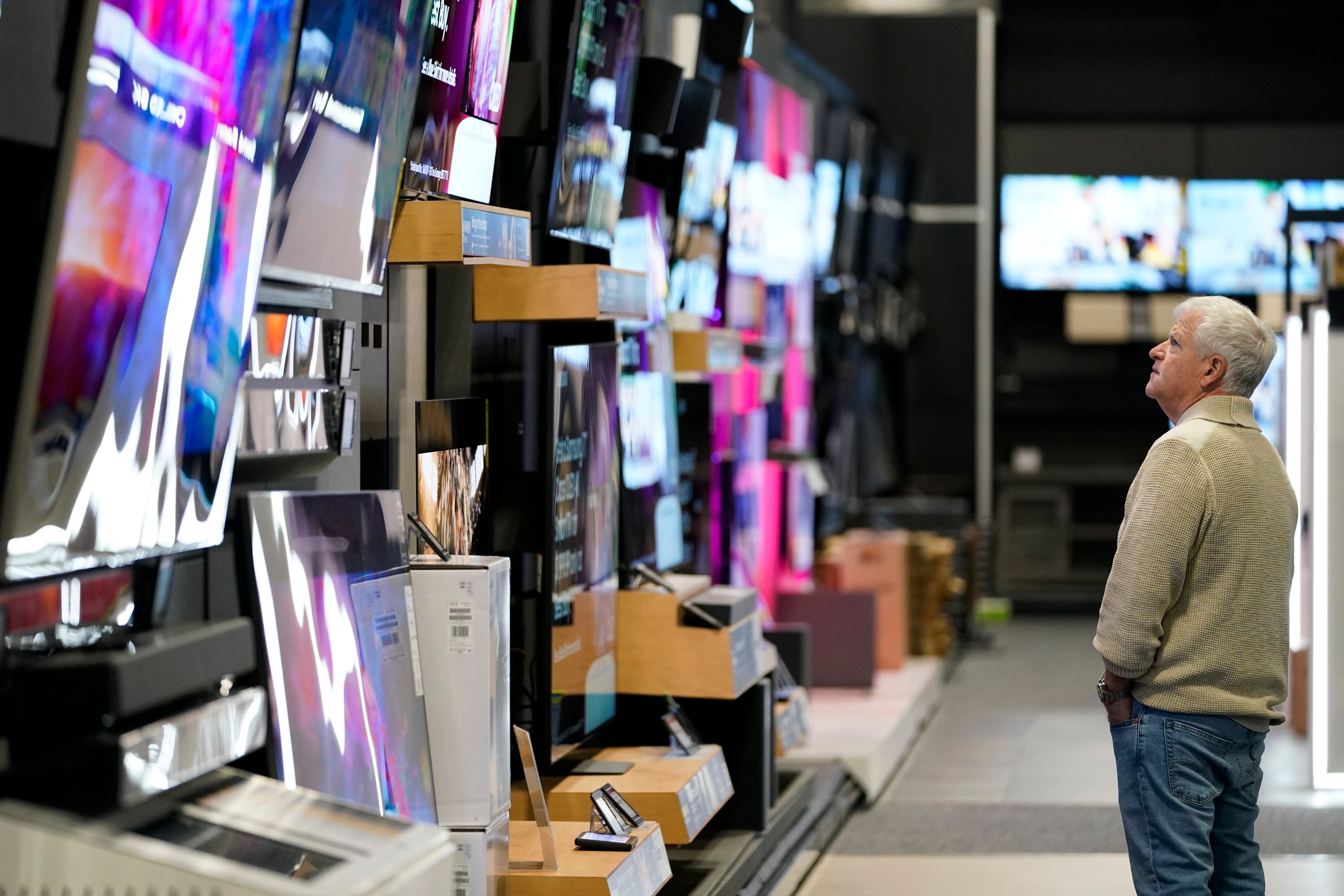 A customer browses televisions at a Best Buy store on Black Friday, which marks the start of the Christmas shopping season, on November 24, 2023, in Charlotte, North Carolina. Photo: AP