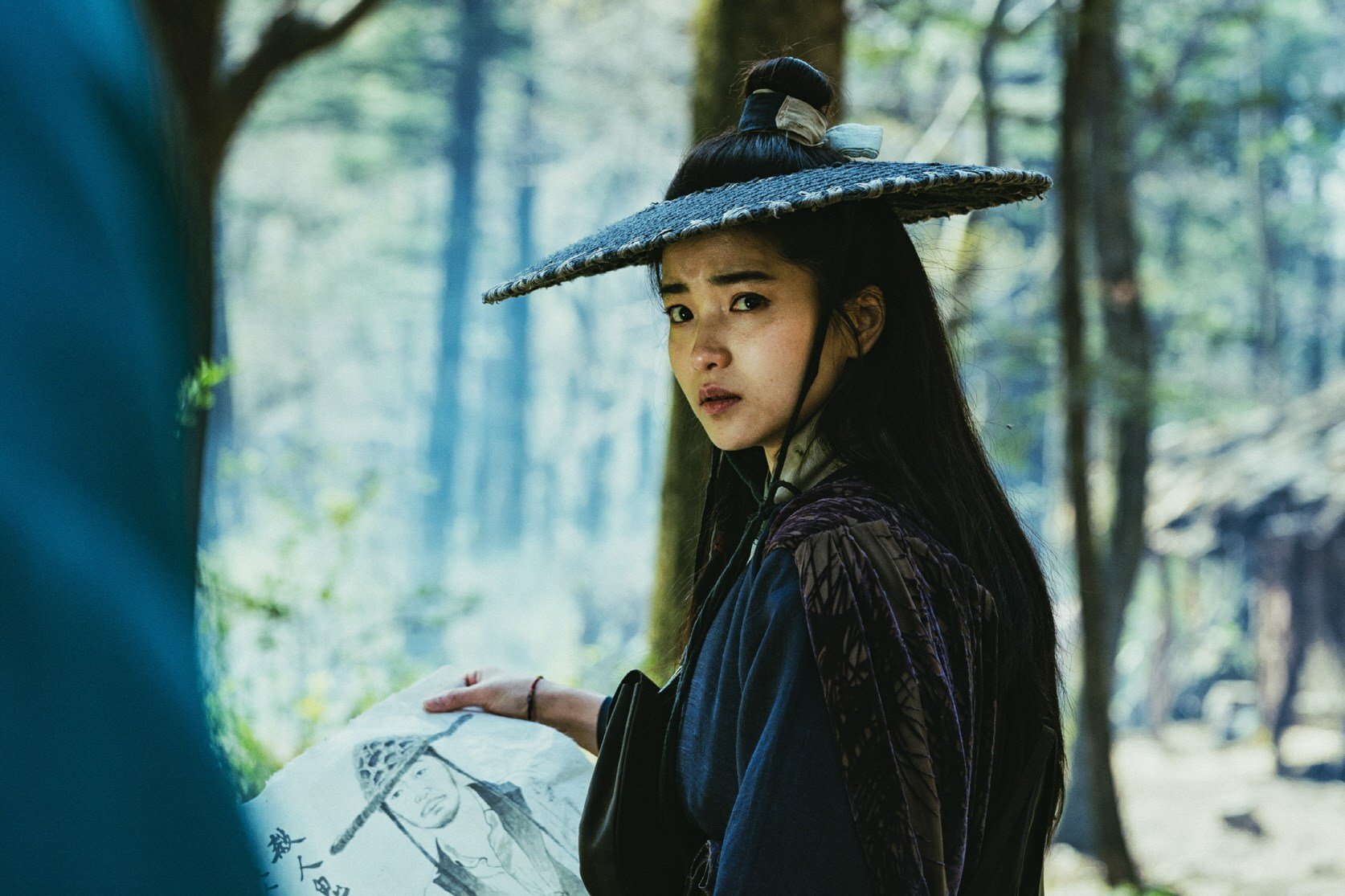 Kim Tae-ri as gun-toting warrior Lee Ahn in a still from “Alienoid: Return to the Future”.