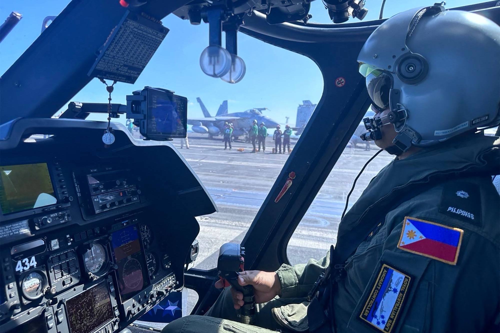 A pilot carries out a final check in a Philippine Navy AW109 helicopter on the deck of the USS Carl Vinson on Jan. 4. Washington and Manila are defence partners in the South China Sea. Photo: Armed Forces of the Philippines/AFP