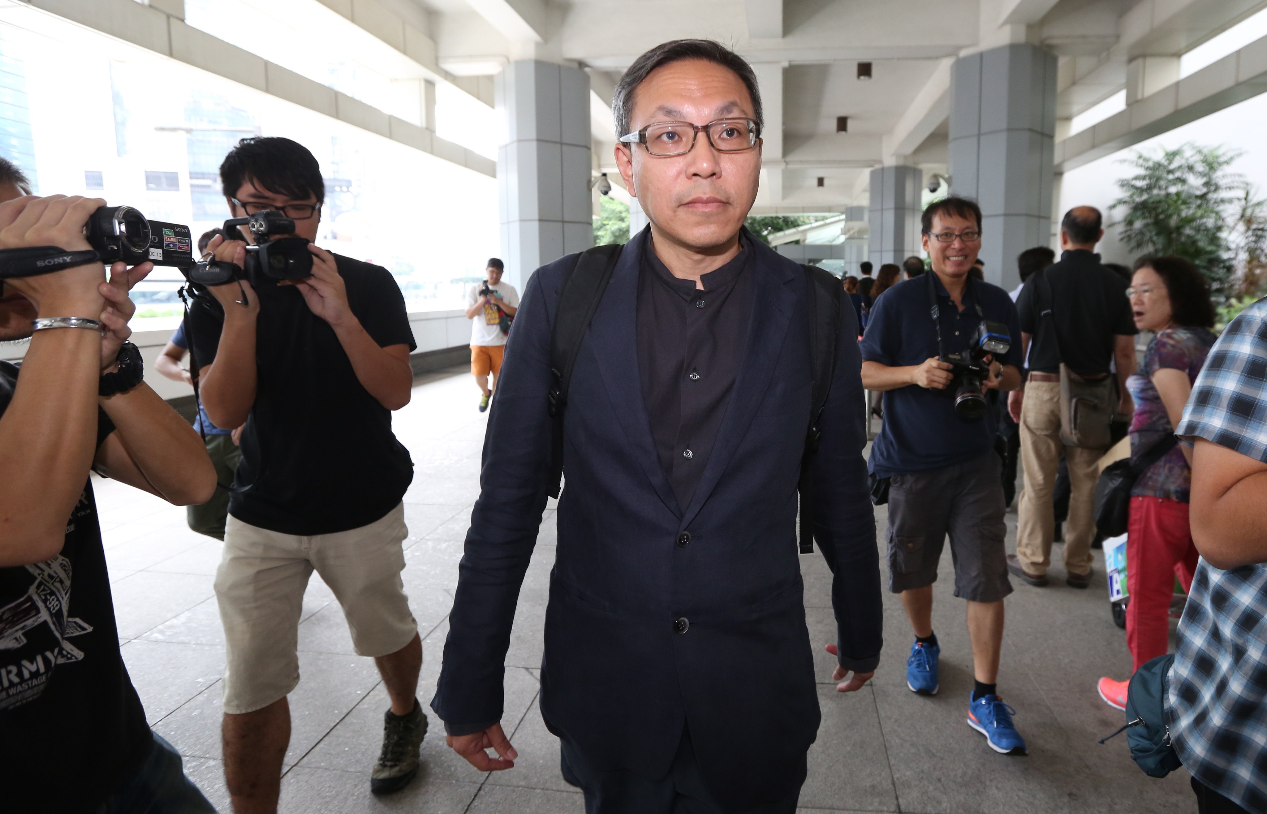 Cheung Kim-hung, the ex-publisher of Apple Daily, arrives at court to give evidence for the prosecution in the trial of Jimmy Lai on conspiracy charges. Photo: Nora Tam