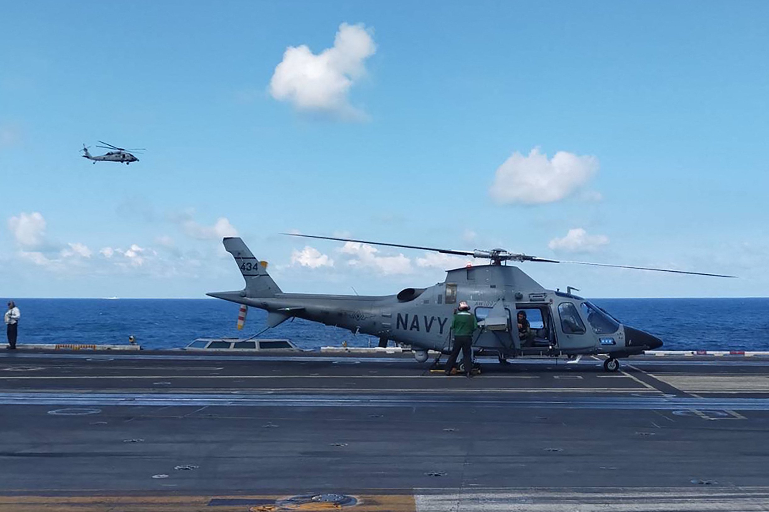 A Philippine Navy AW109 helicopter is pictured on January 4 on the deck of the USS Carl Vinson during joint military exercises. The PLA  sent its navy and air force to monitor activities. Photo: Armed Forces of the Philippines/AFP