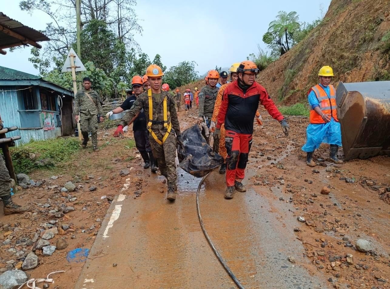 At least ten people were killed following a landslide that buried houses from heavy rain in the remote town of Monkayo, the Philippines. Photo: EPA-EFE/Municipality of Monkayo/Handout