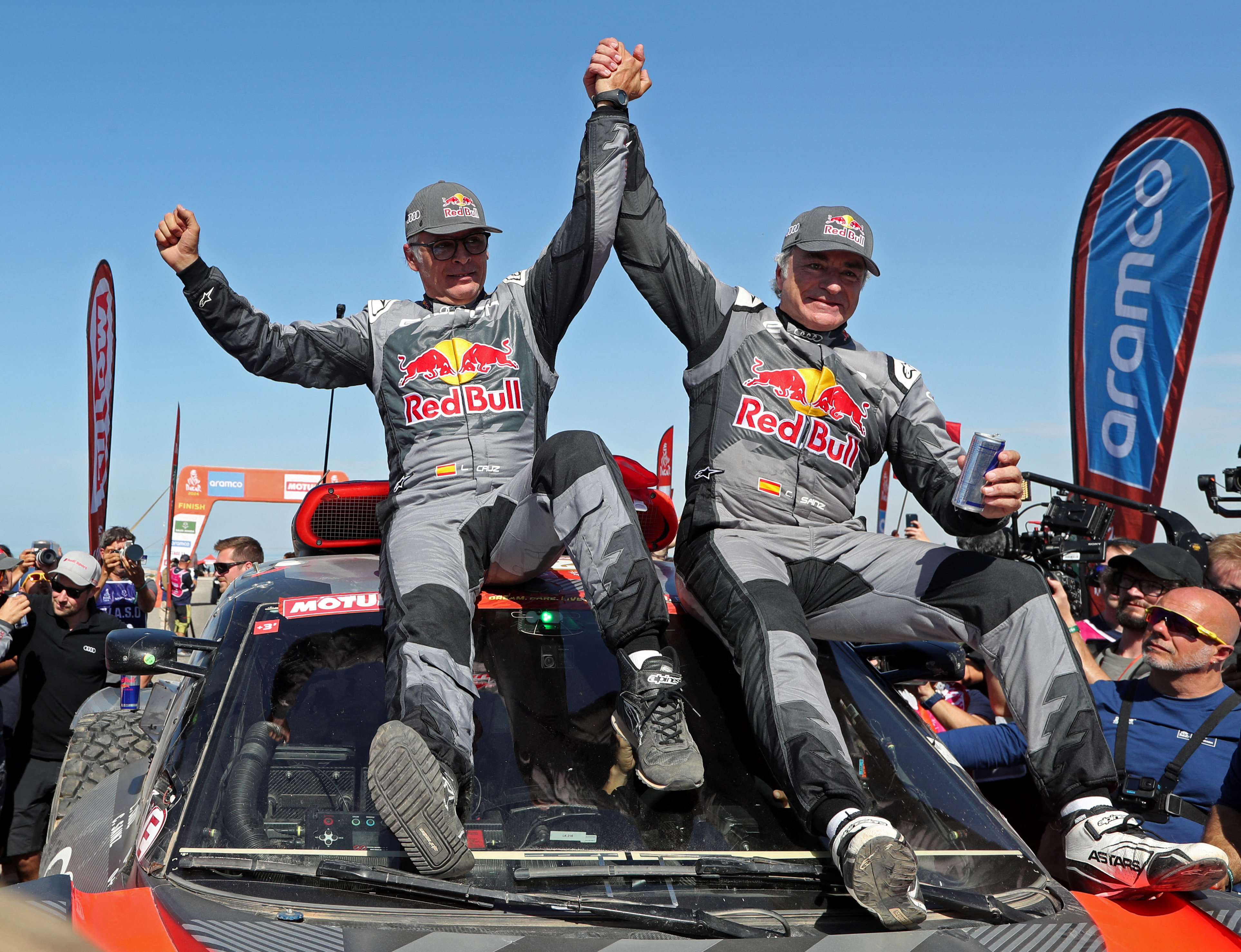 Carlos Sainz (right) and co-driver Lucas Cruz celebrate after winning the car category at the Dakar Rally. Photo: Reuters