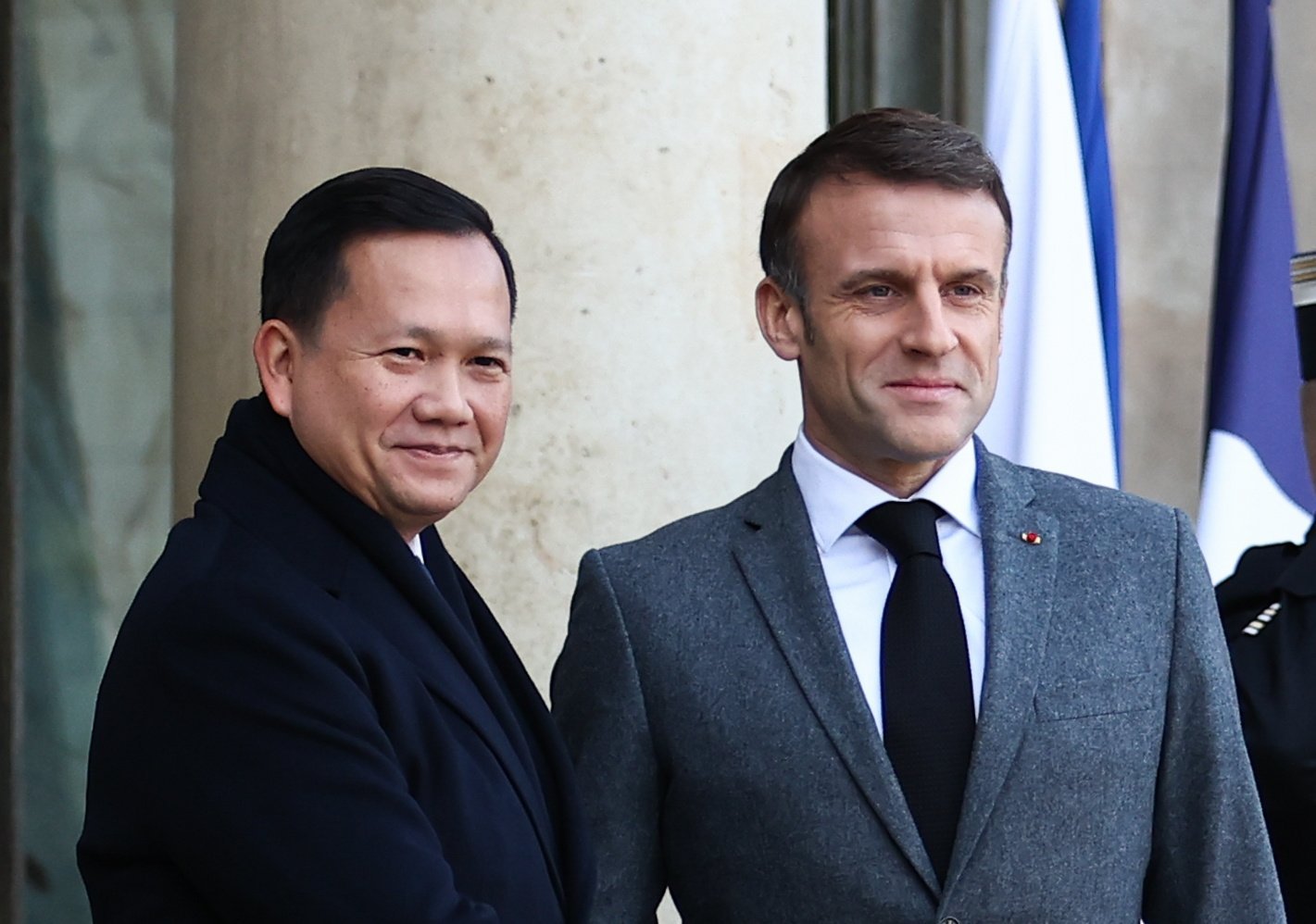 French President Emmanuel Macron (right) receives Cambodian Prime Minister Hun Manet prior to their meeting at the Elysee Palace in Paris, France, on Thursday. Photo: EPA-EFE
