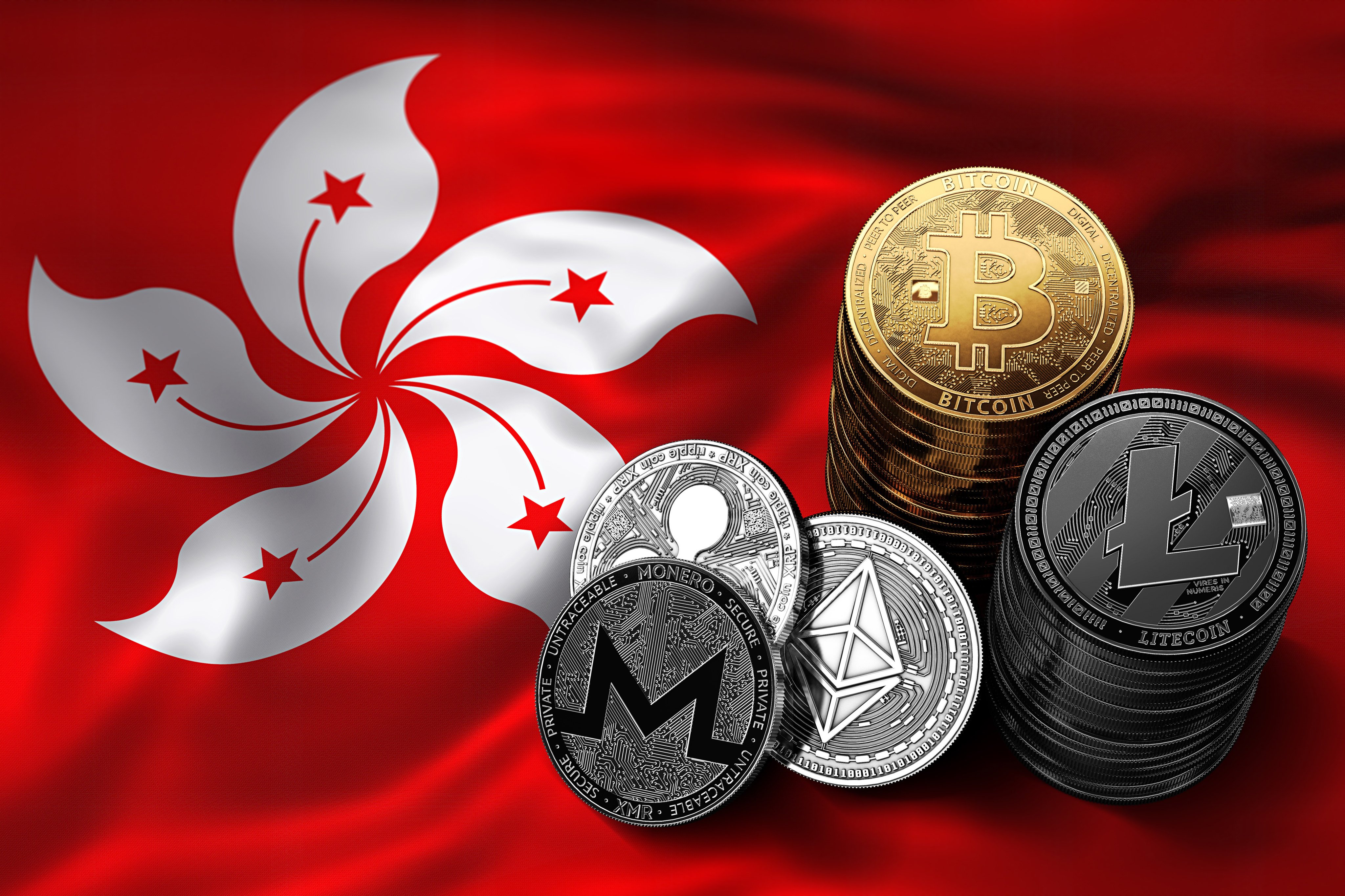 Stacks of cryptocurrency coin representations are set against the backdrop of the Hong Kong flag. Photo: Shutterstock Images