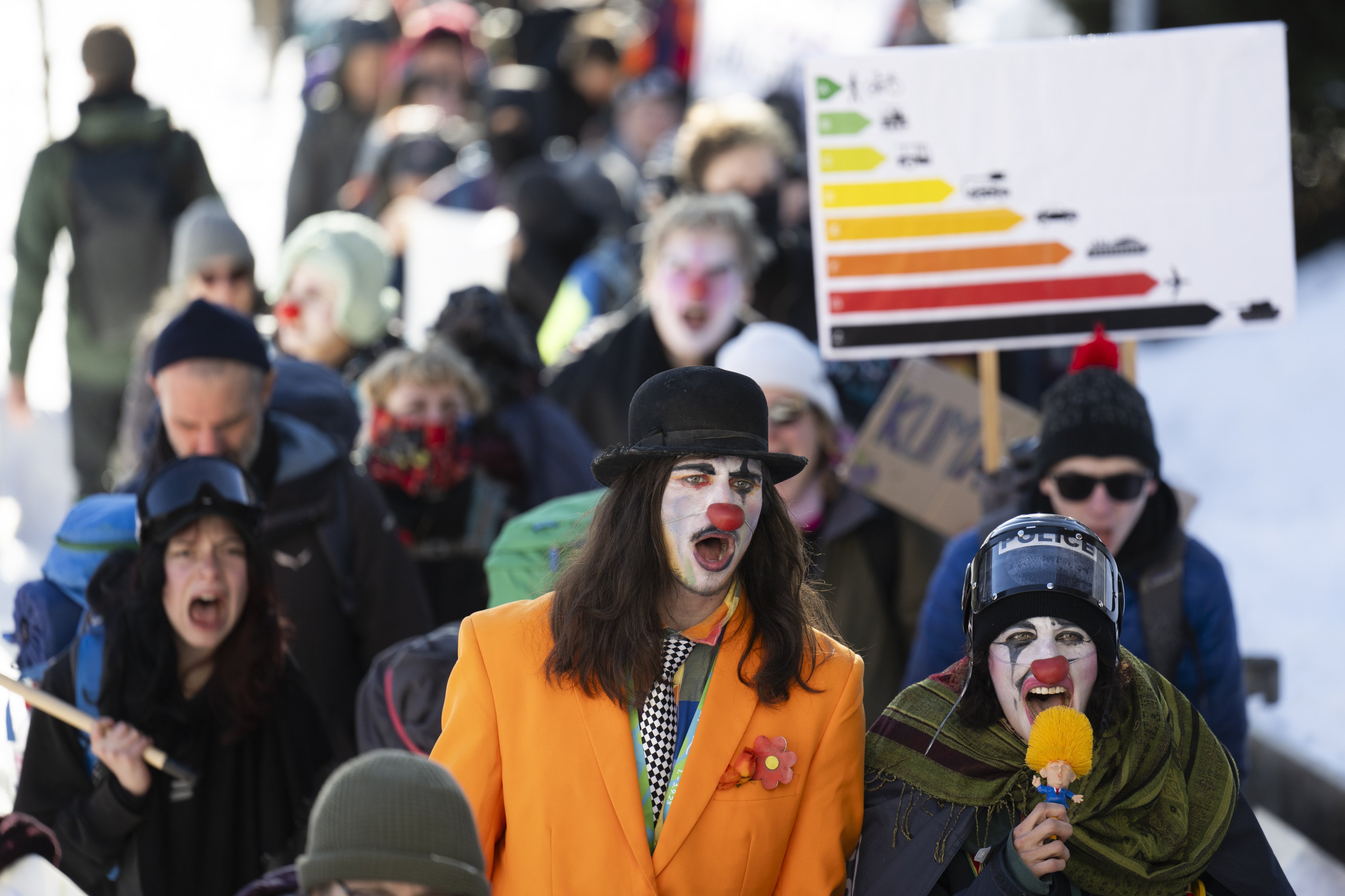 Demonstrators in clown costumes at the 54th World Economic Forum in Davos, Switzerland, on January 14,  where the theme was Rebuilding Trust. Photo: EPA-EFE