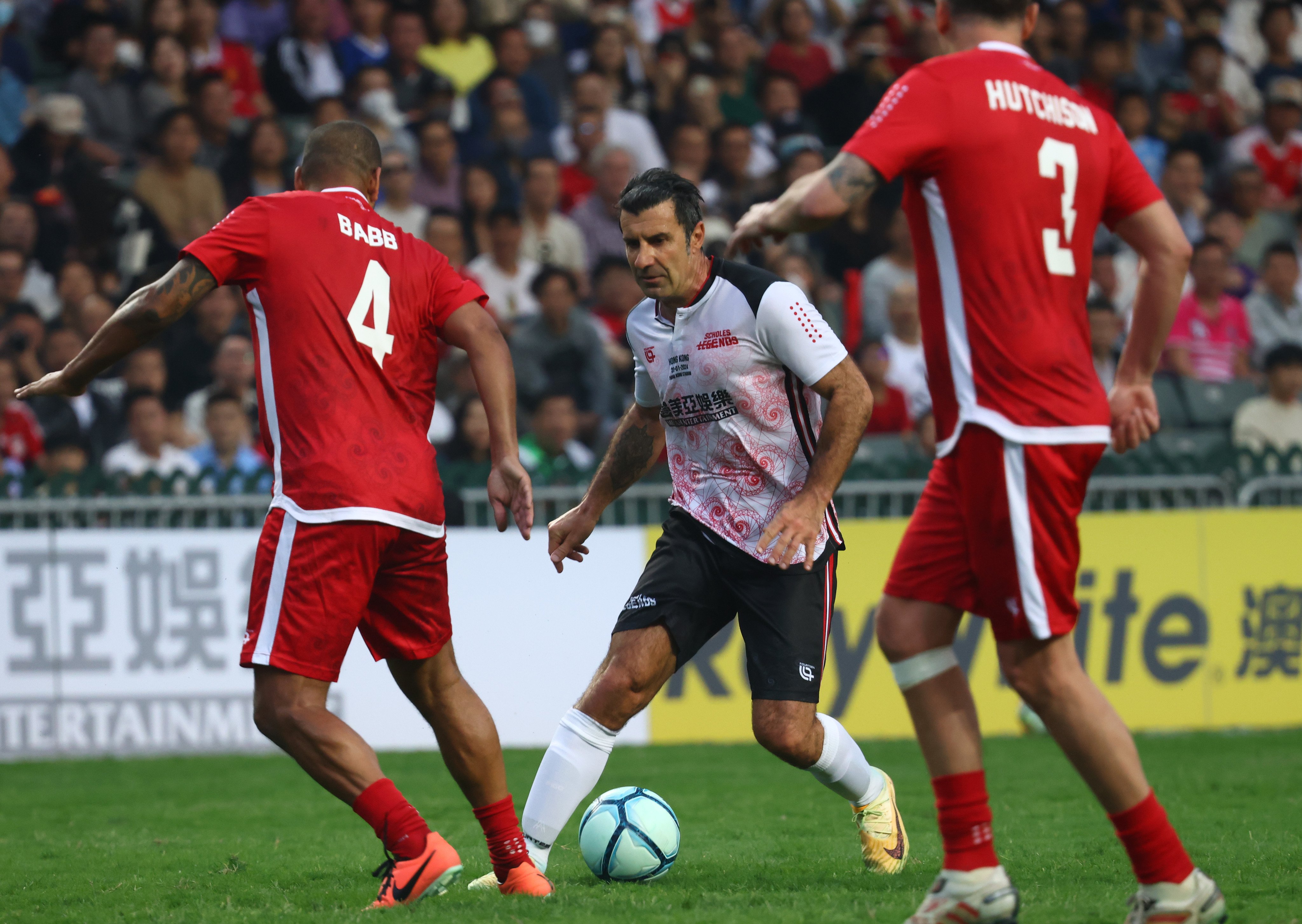 Luis Figo on the ball for the Scholes Legends at Hong Kong Stadium. Photo: Dickson Lee