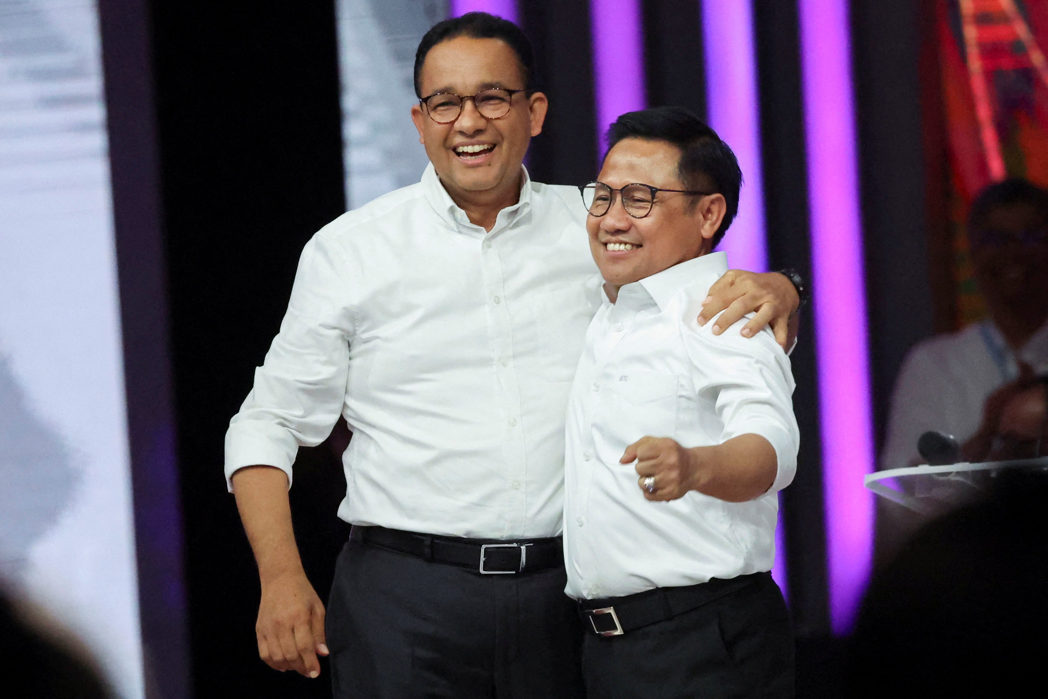 Presidential candidate Anies Baswedan and his running mate Muhaimin Iskandar react during a televised debate on Sunday. Photo: Reuters
