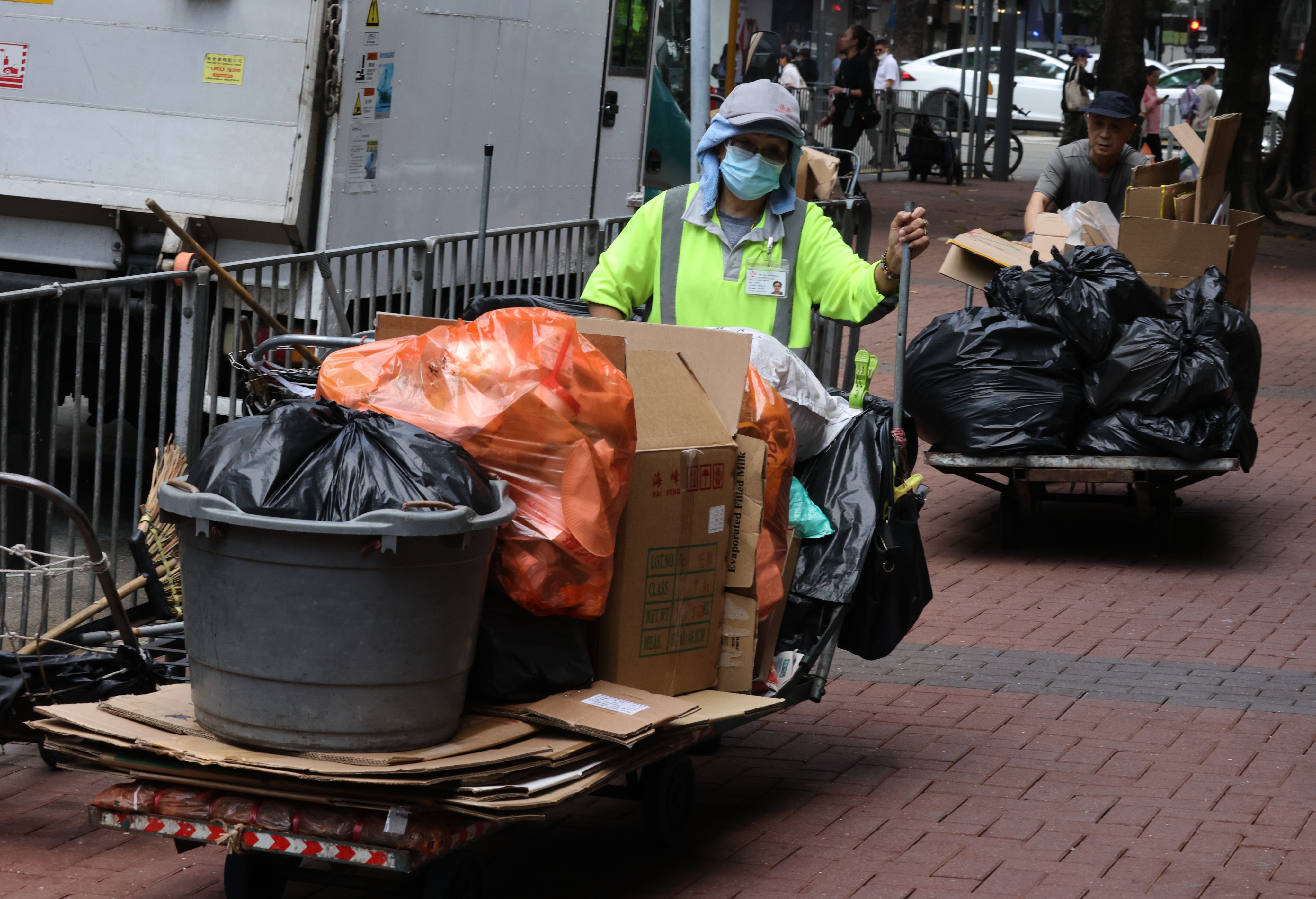 Workers take household waste to the Luard Road Refuse Collection Point in Wan Chai on January 19. Photo: Yik Yeung-man