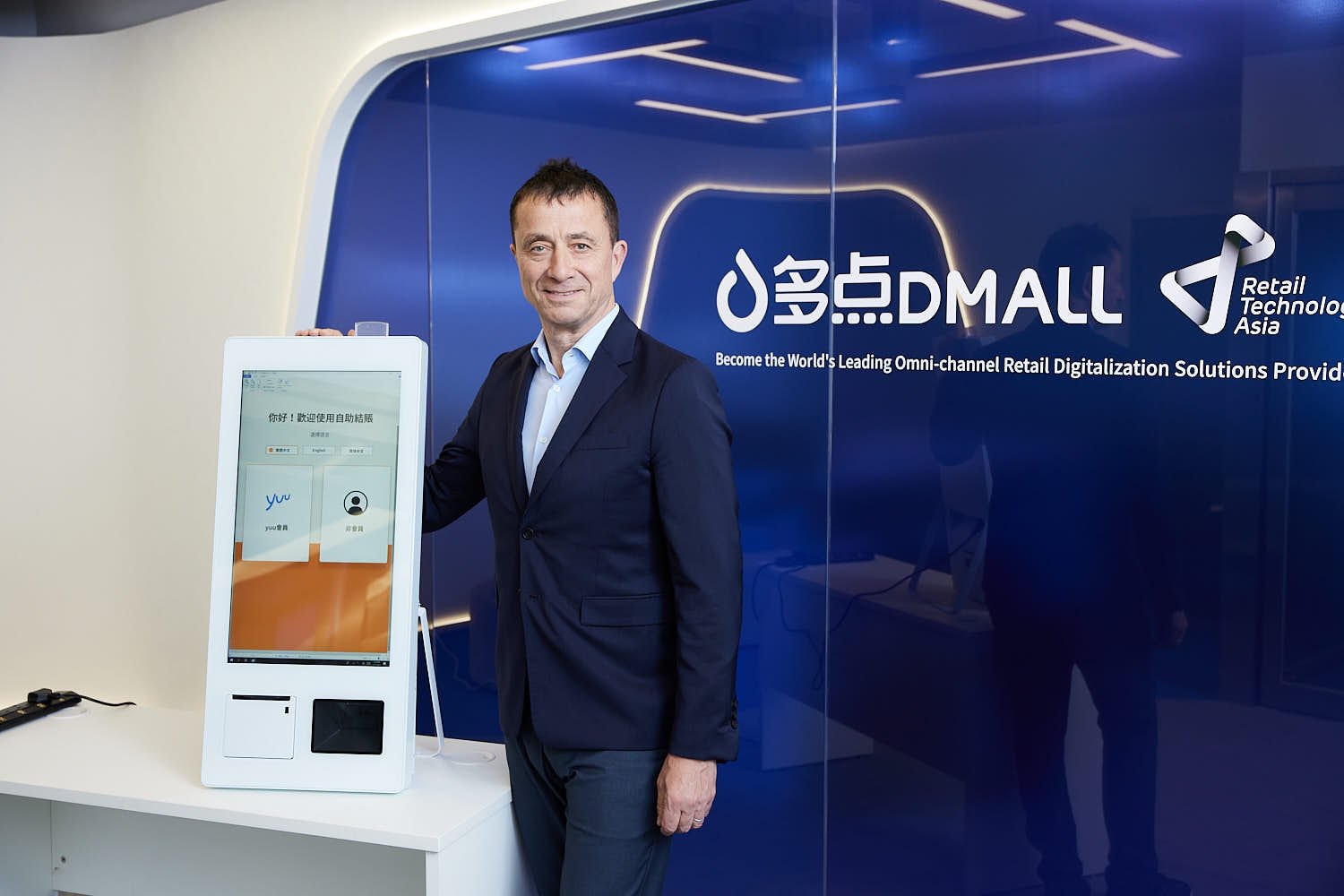 Marcus Spurrell, CEO of Dmall, with one of his company’s self-service checkout machines widely used in Hong Kong supermarkets, such as Wellcome and Market Place, which are owned by DFI Retail Group.