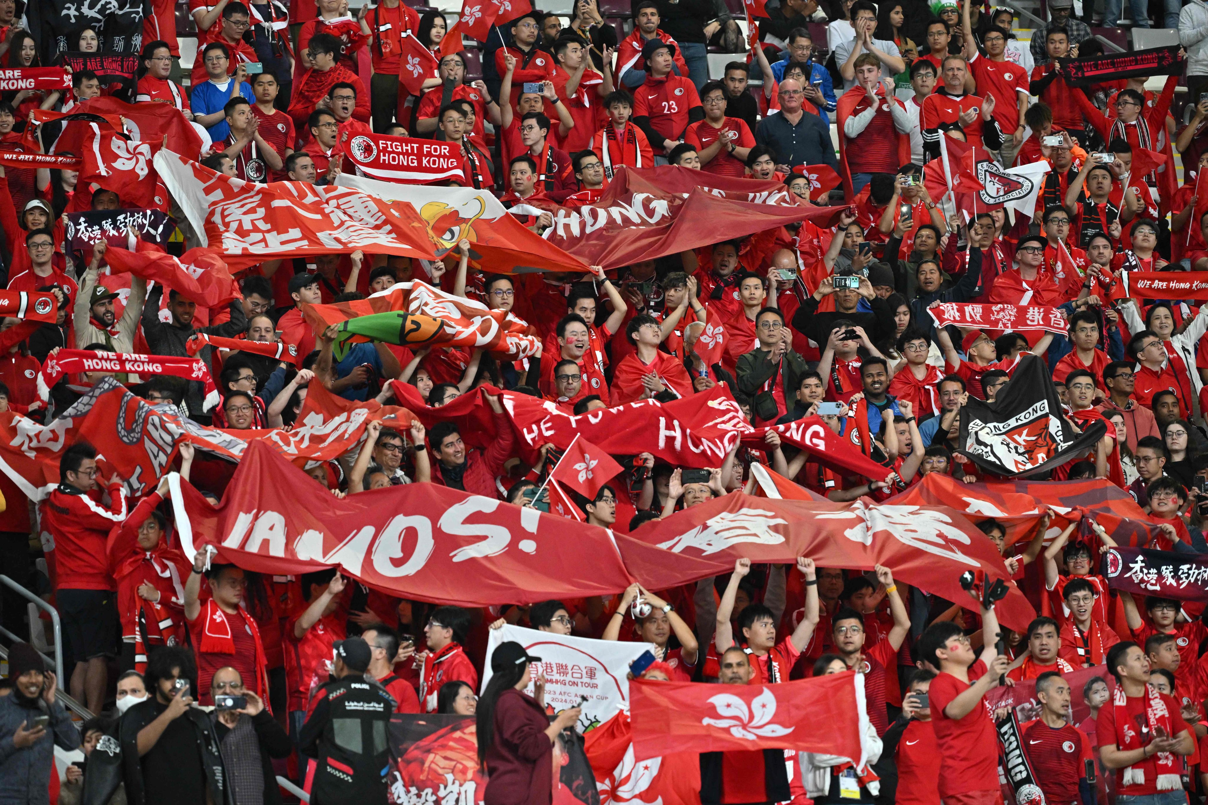 Hong Kong supporters cheer for their team before the start of the Asian Cup Group C game against Iran at the Khalifa International Stadium. Photo: AFP