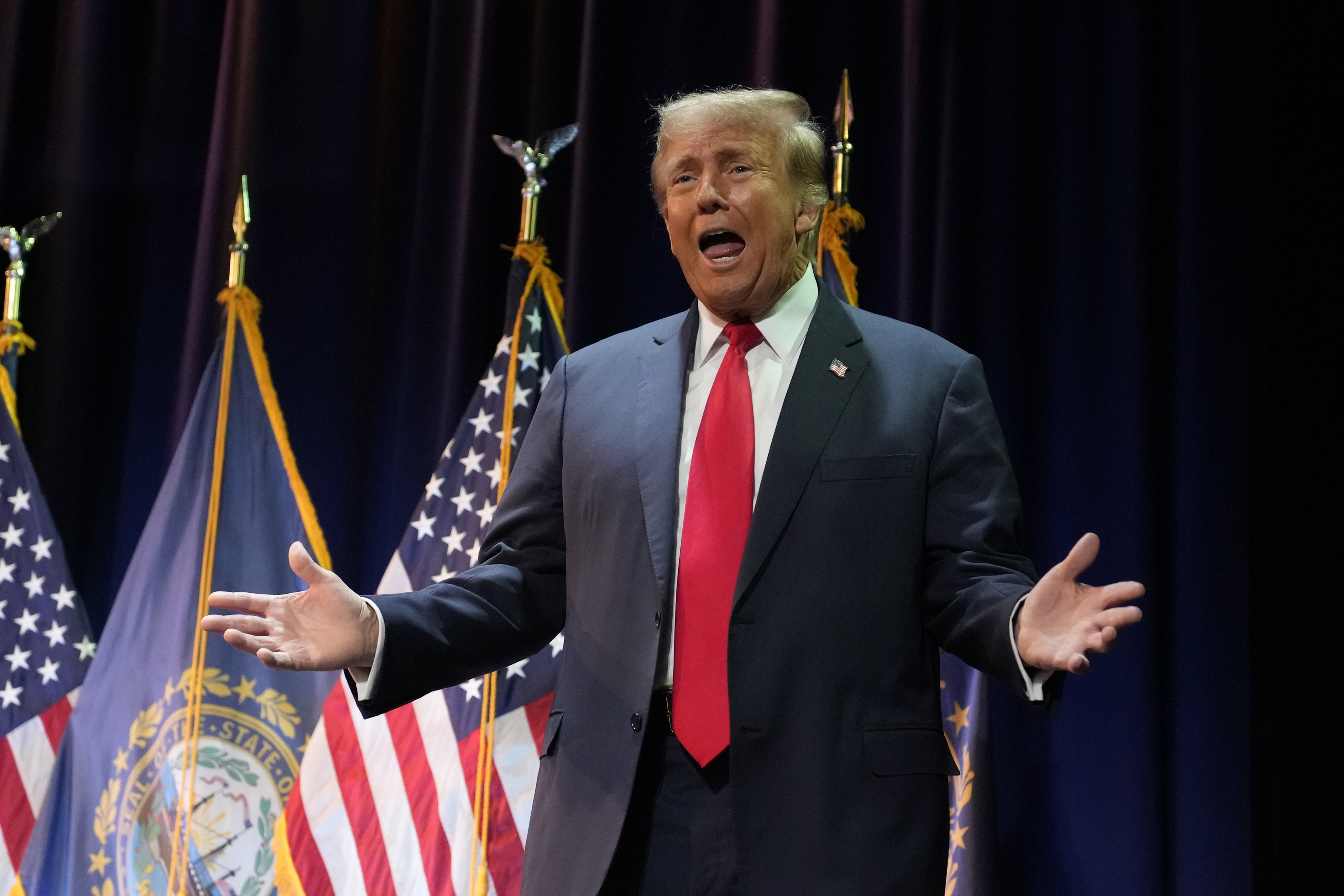 Former president Donald Trump takes the stage during a campaign stop in Rochester, New Hampshire, on Sunday. Photo: AP