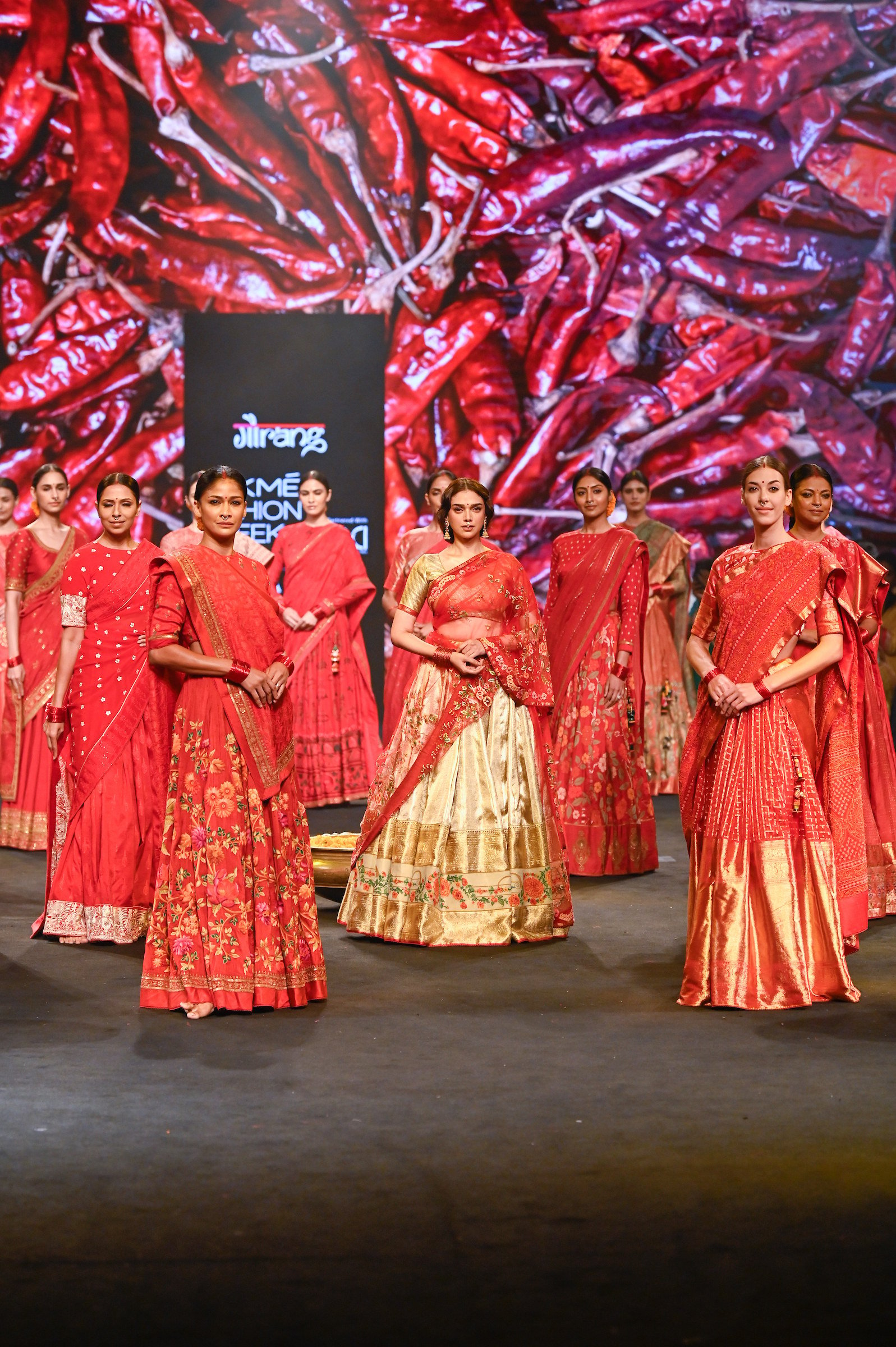 Indian actress Aditi Rao Hydari (centre) in a sari during a show at the FDCI x Lakmé Fashion Week 2022 in Mumbai, India. The Indian sari dates back centuries. Photo: Gaurang