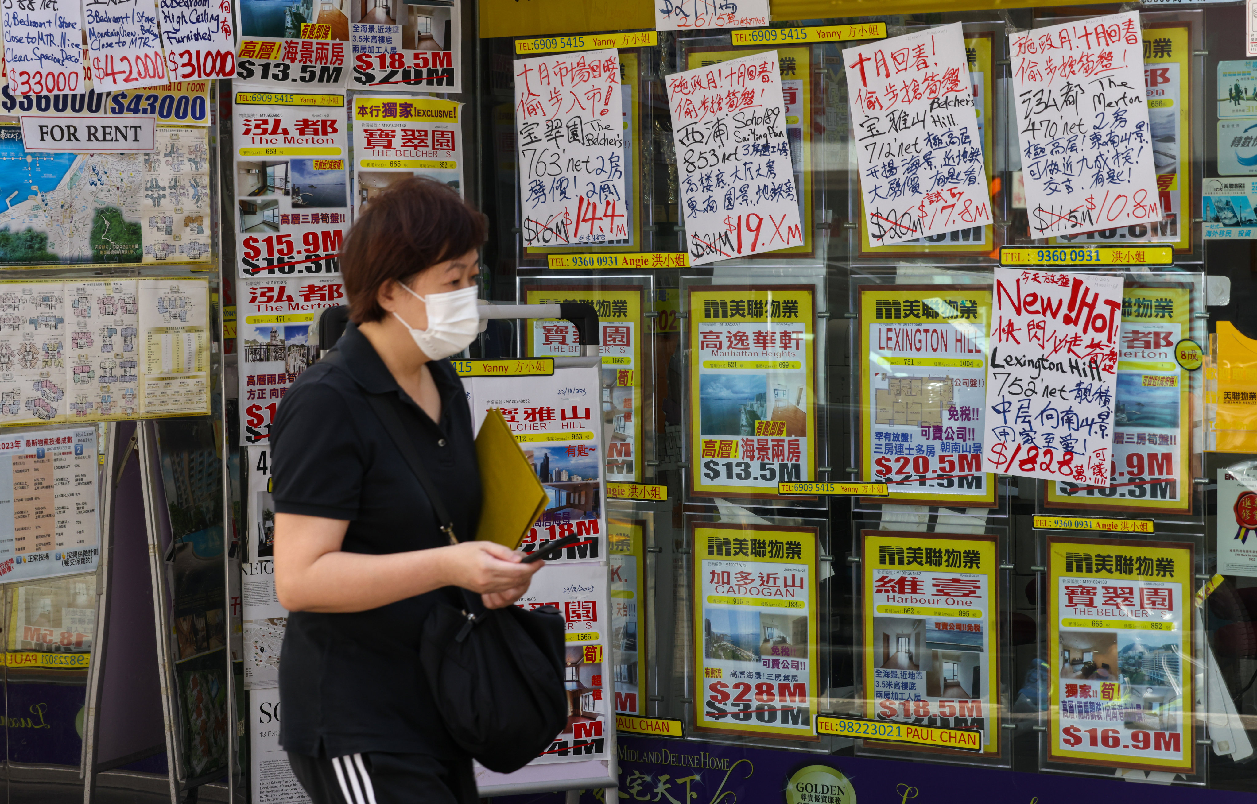 Residential property advertisements at a real estate agency. The scrapping of various stamp duties has been proposed to stimulate the market. Photo: Yik Yeung-man