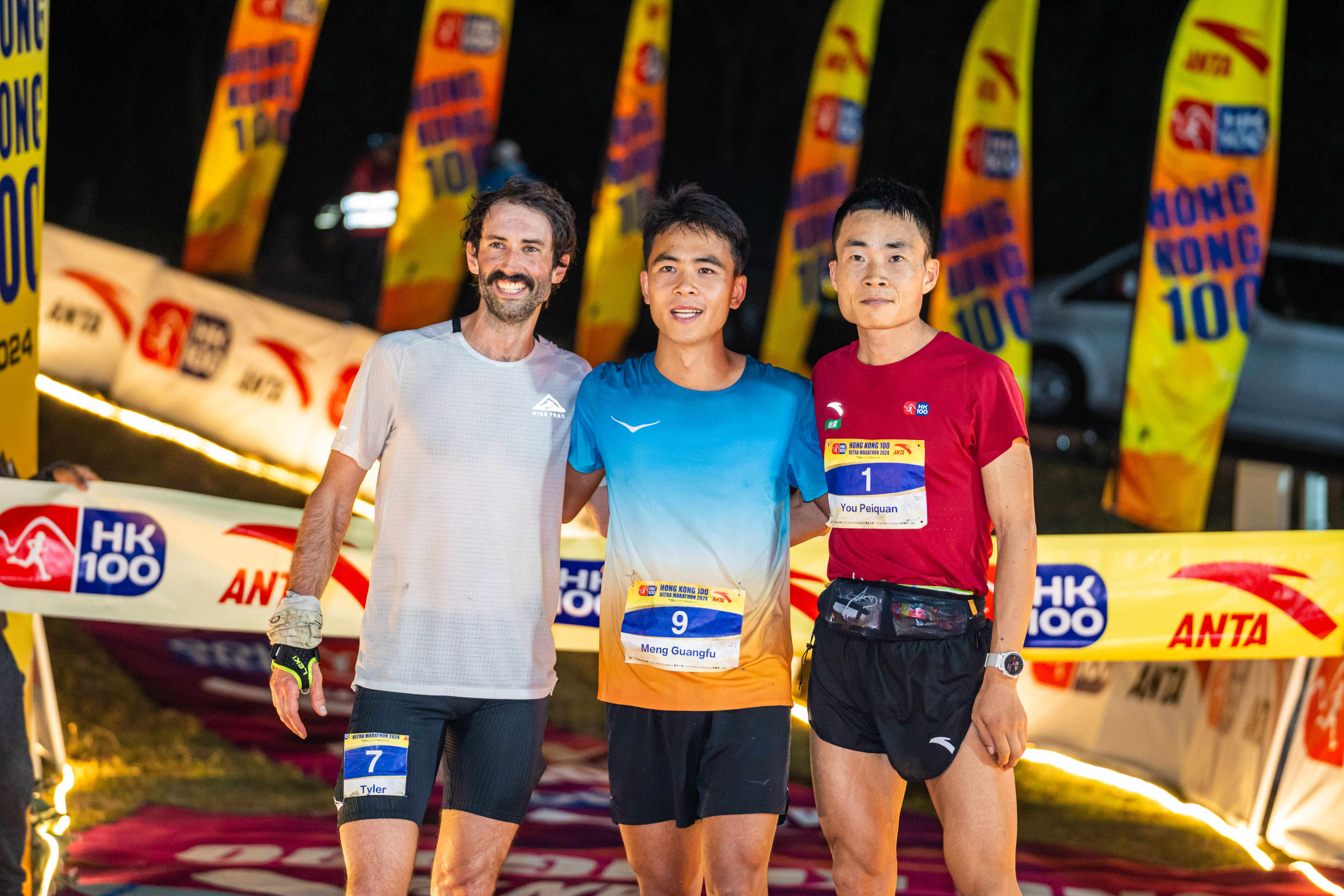 HK100 winner Meng Guangfu (centre) flanked by Tyler Green (left) and You Peiquan. Photo: Anta Brand