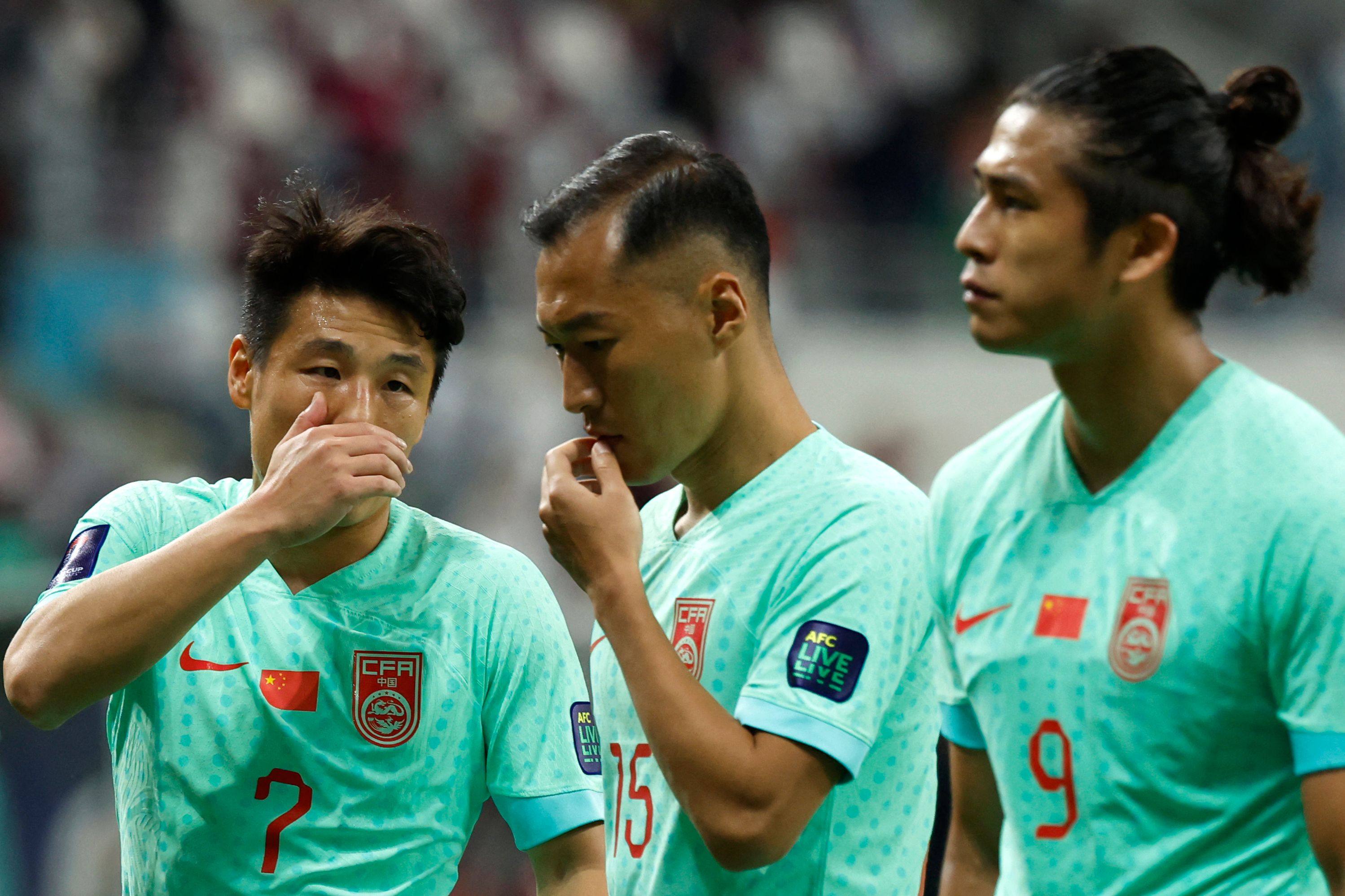 China forward Wu Lei (left), along with teammates Wu Xi (centre) and Zhang Yuning, is downcast after Monday’s defeat. Photo: AFP