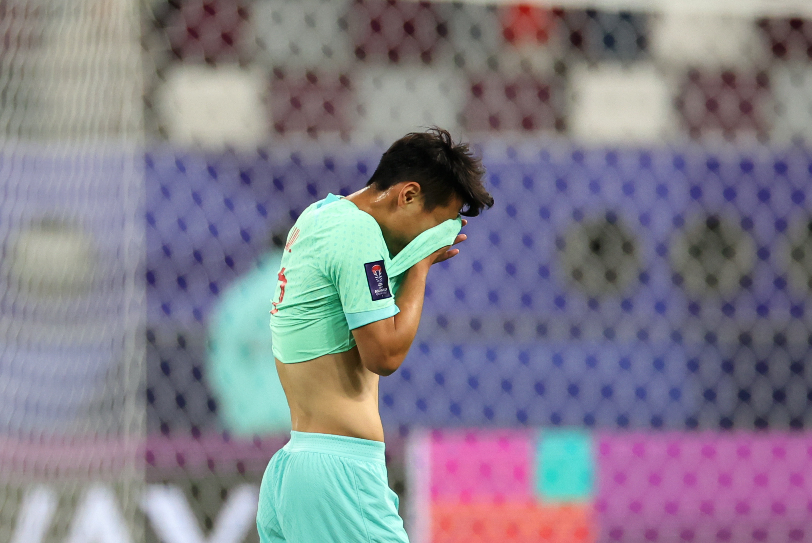 Wu Lei of China cuts a dejected figure after the Group A loss to Qatar. Photo: Xinhua