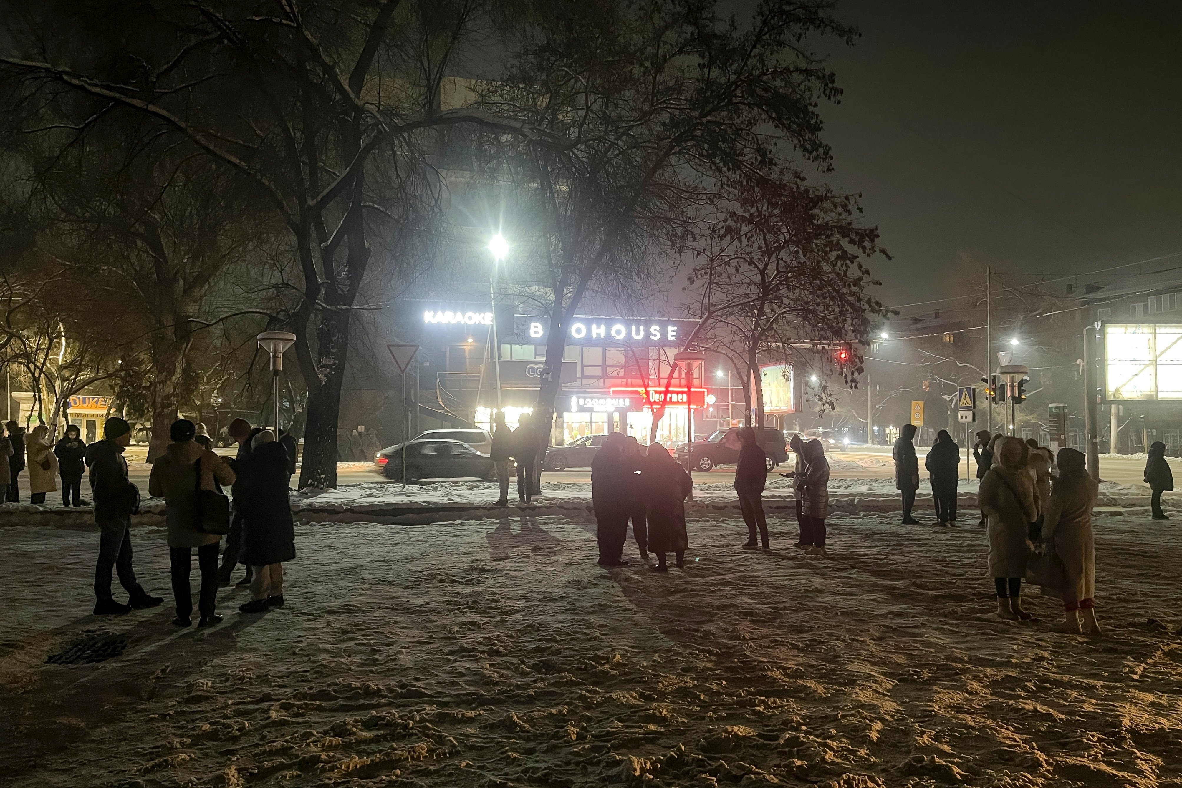 People gather in a street after leaving their flats following an earthquake in Almaty, Kazakhstan on Monday. The epicentre was 121km west of the Chinese county Aksu and 270km southeast of Kazakhstan’s Almaty. Photo: NUR.KZ via AP