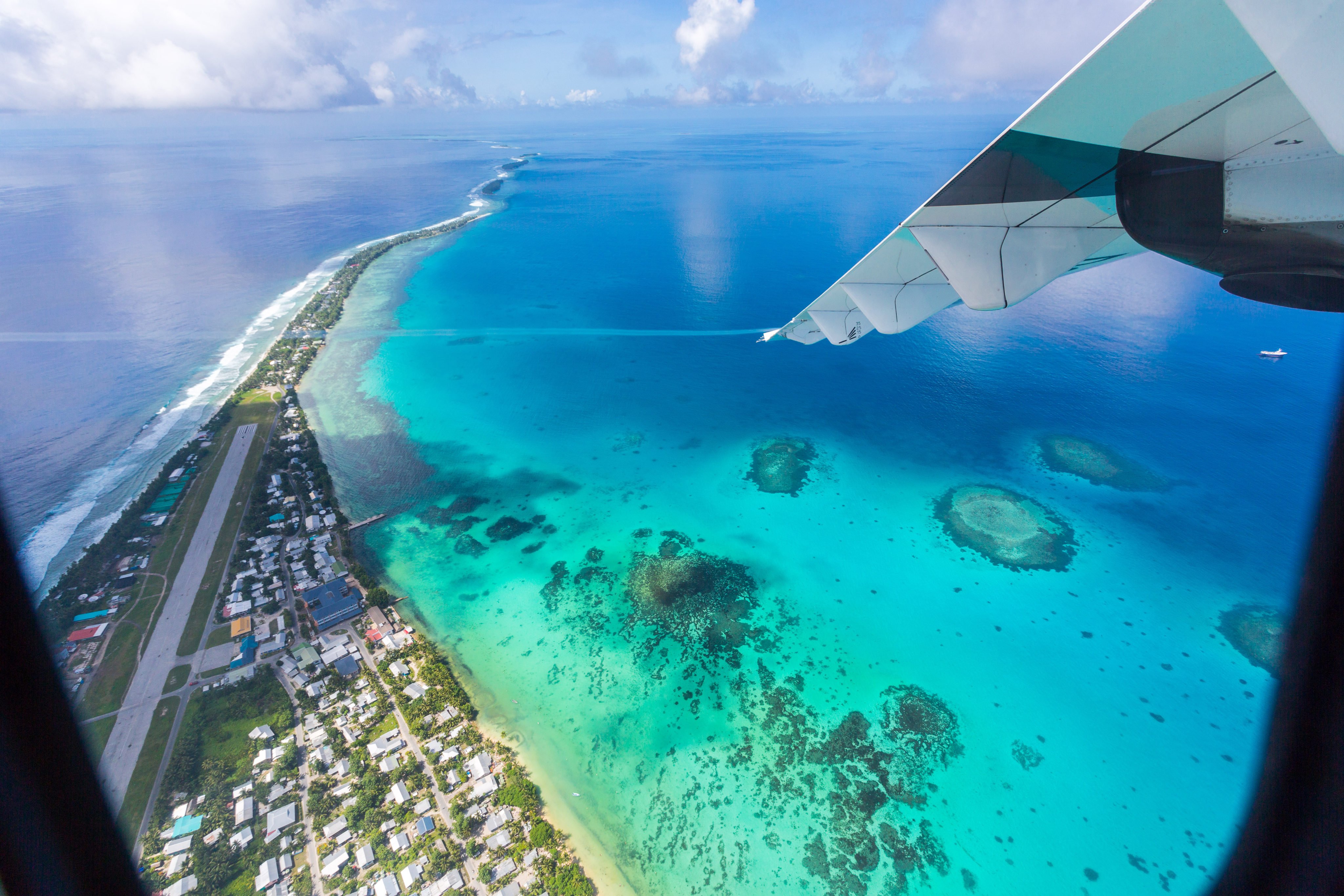 Tuvalu under the wing of an airplane. The Pacific island nation is reportedly planning to end its diplomatic relationship with Taiwan. Photo: Getty Images