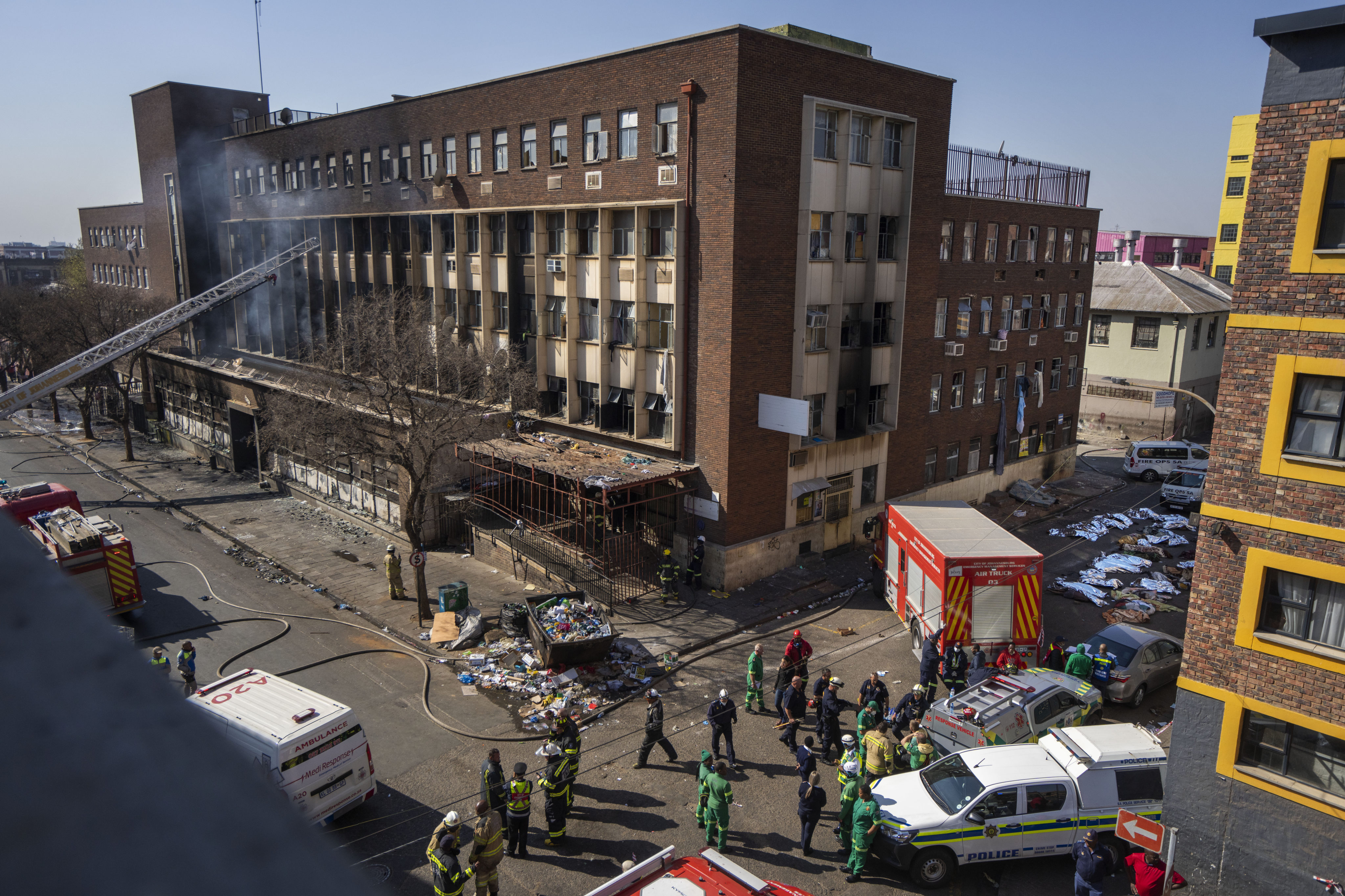 Emergency crews work at the scene of a deadly blaze in downtown Johannesburg, South Africa in August. Photo: AP