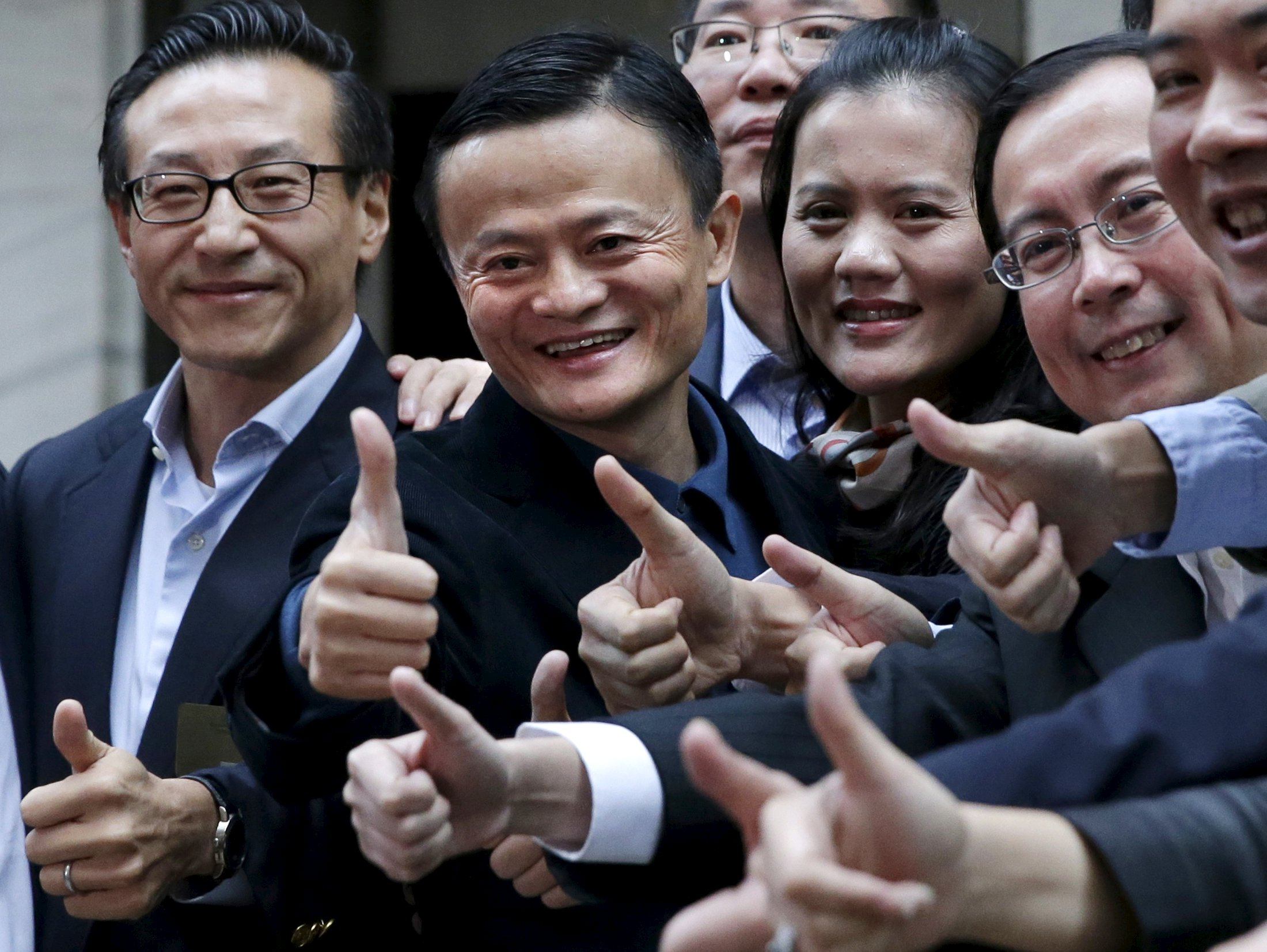 Joe Tsai (first left) and Jack Ma (second left) during the initial public offering of Alibaba Group Holding on the New York Stock Exchange on September 19, 2014. Photo: Reuters.