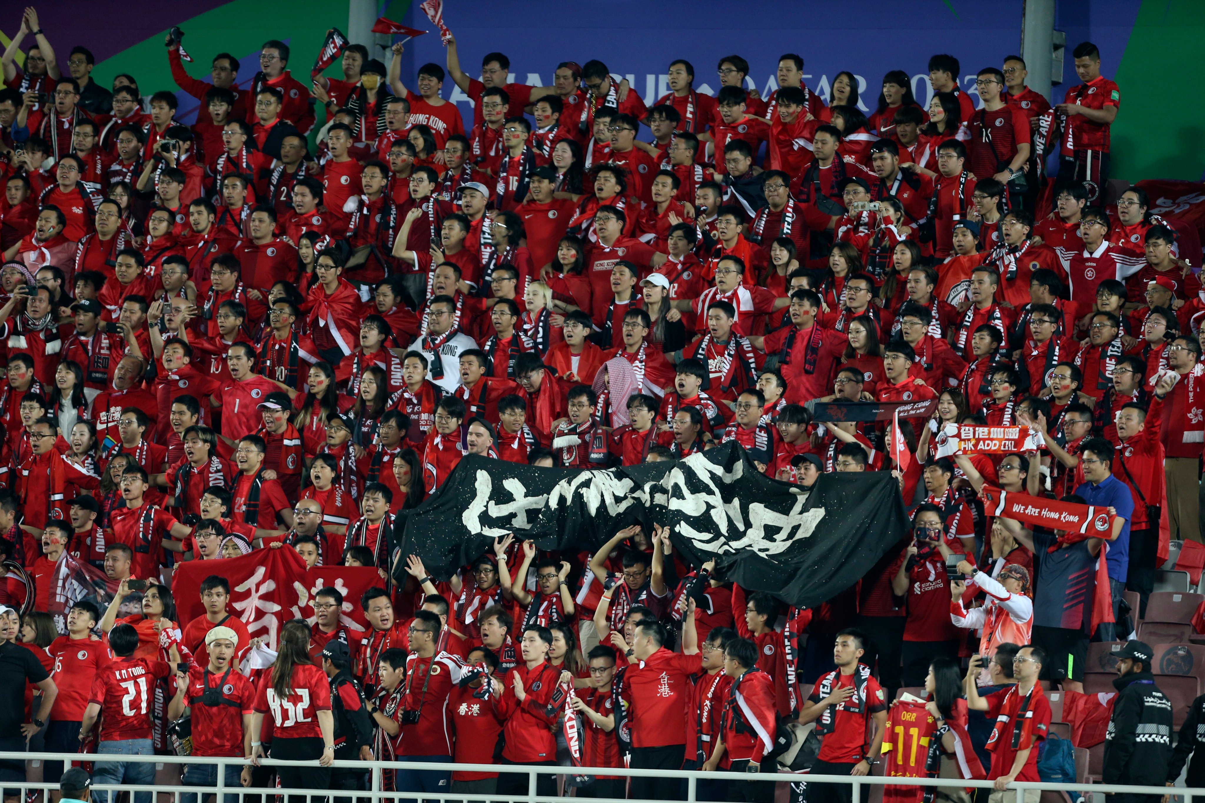 Hong Kong fans show their support at the end of the loss to Palestine in Doha. Photo: AP