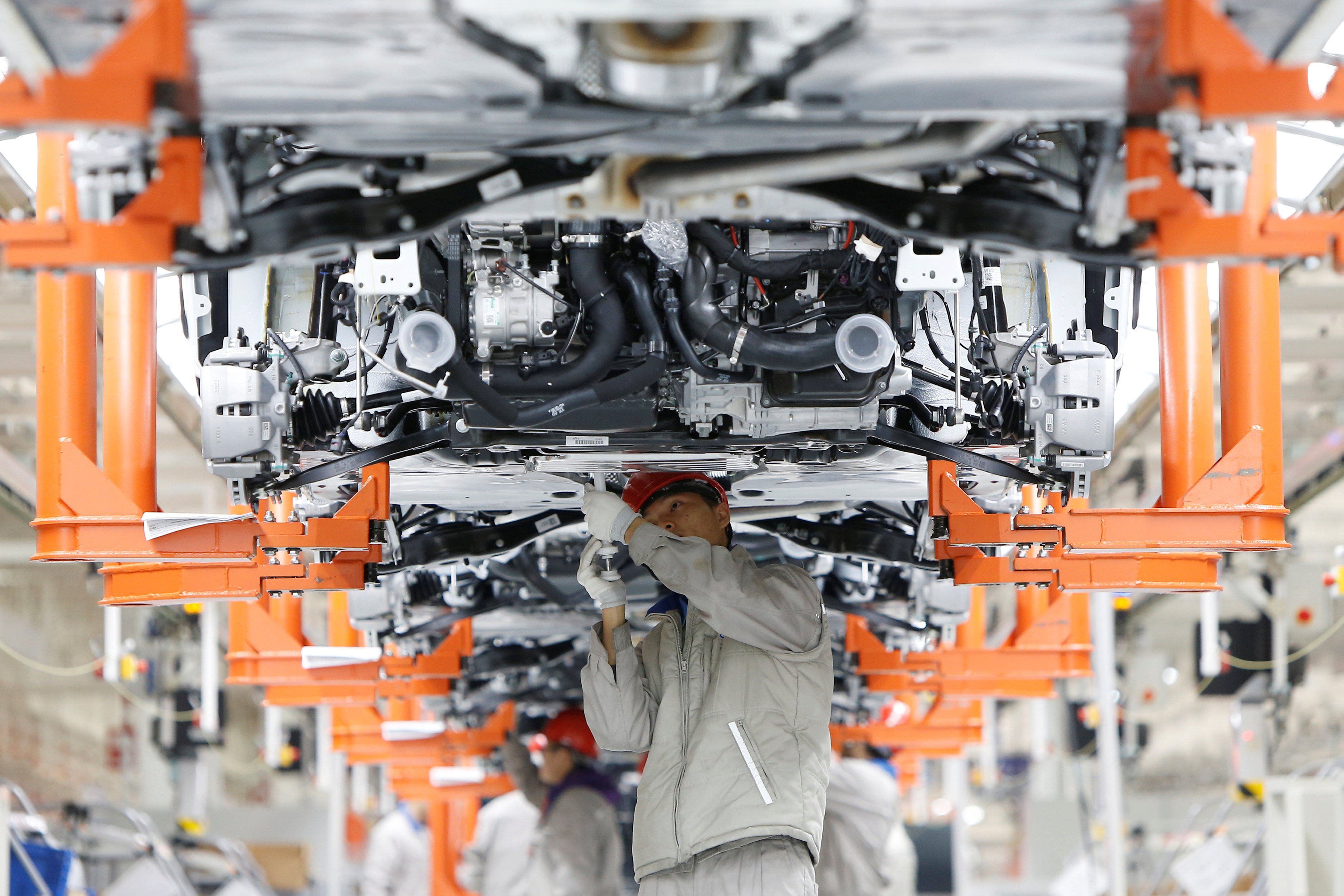 Workers on a production line for Volkswagen Tayron cars at the FAW-Volkswagen plant in Tianjin. Photo: Reuters
