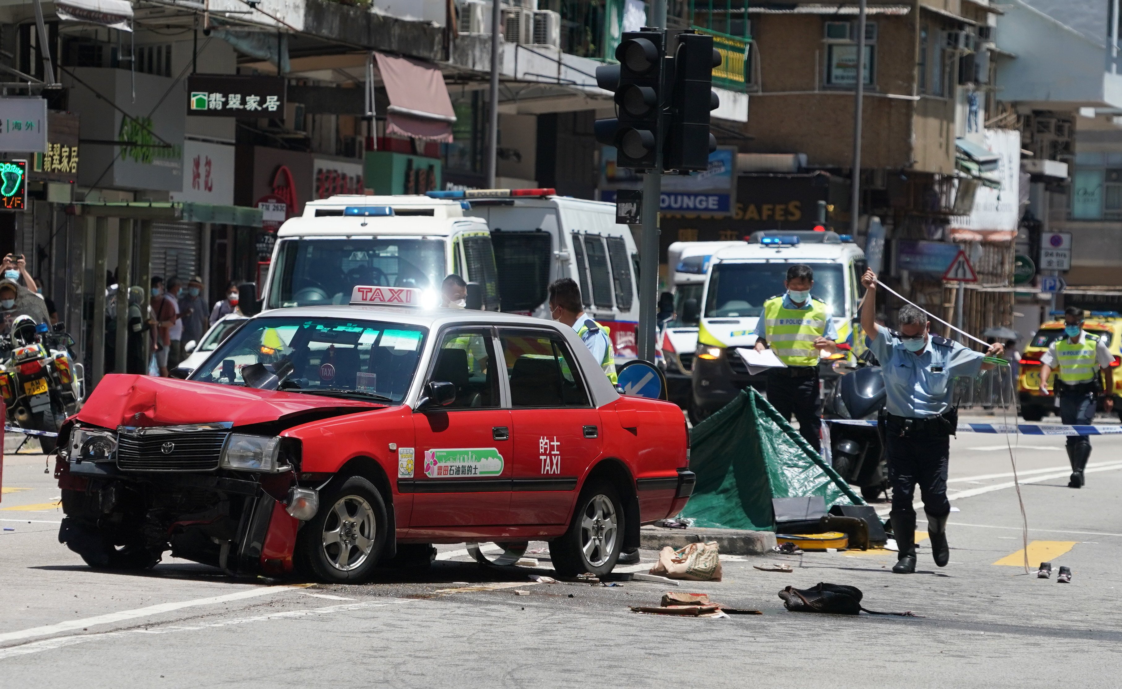 The aftermath of the crash on Kwong Fuk Road in Tai Po. One person died at the scene, and another a day later in hospital. Photo: Felix Wong