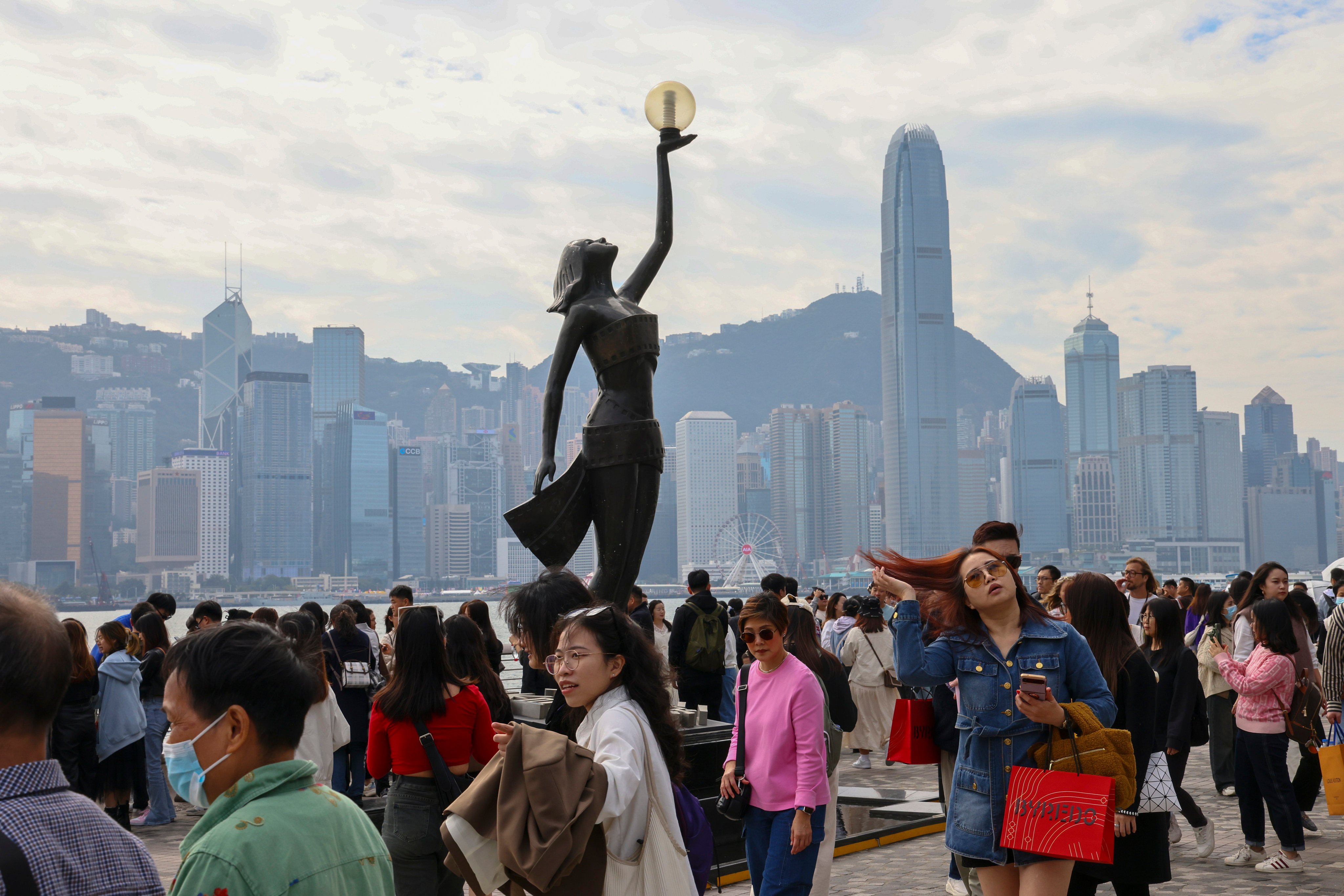Visitors enjoy the sights at the Avenue of Stars in Hong Kong.  Photo: Dickson Lee