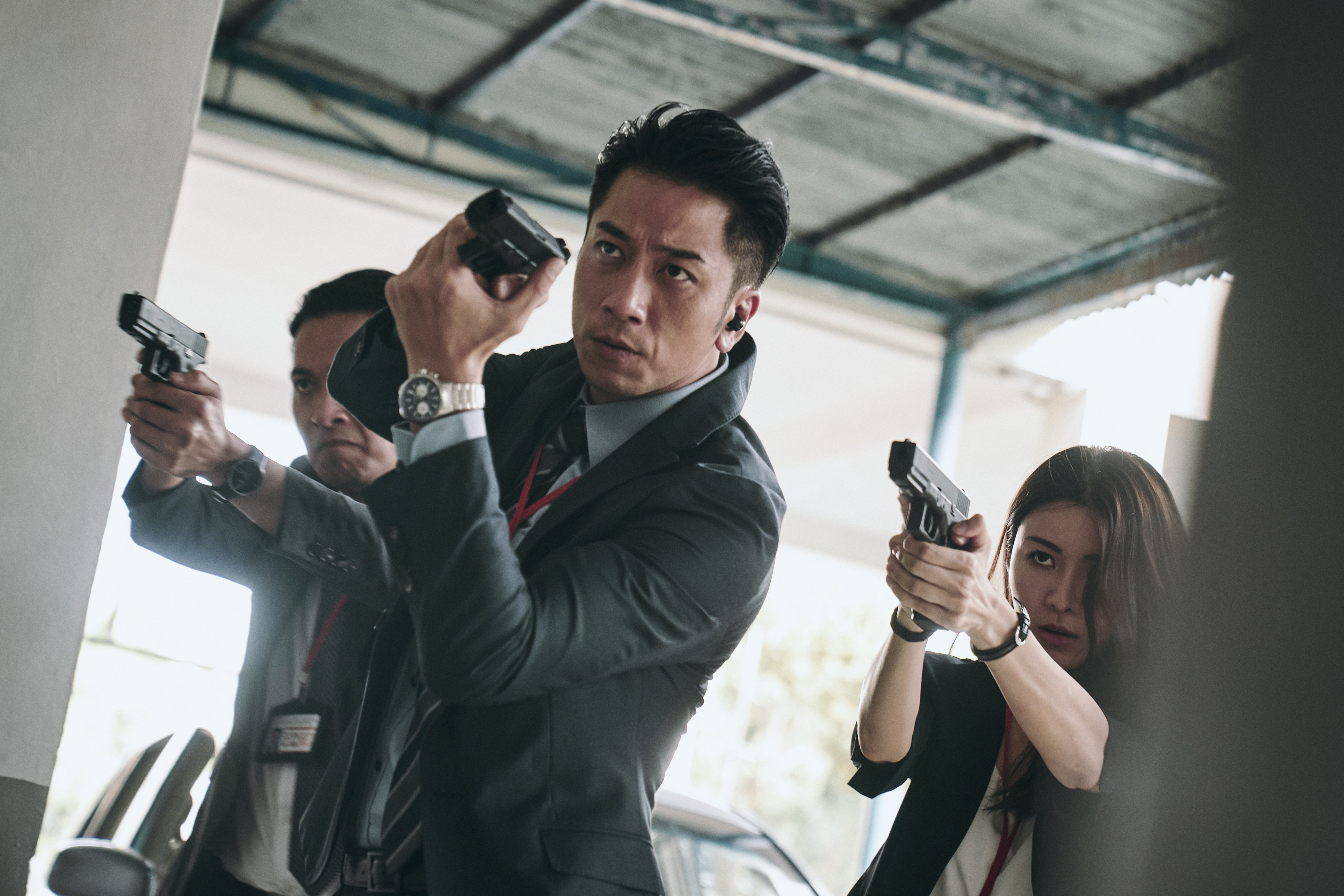 Ron Ng (front) in a still from “Crypto Storm” (category IIB; Cantonese), directed by Terry Ng and co-starring Edward Ma and Justin Cheung.